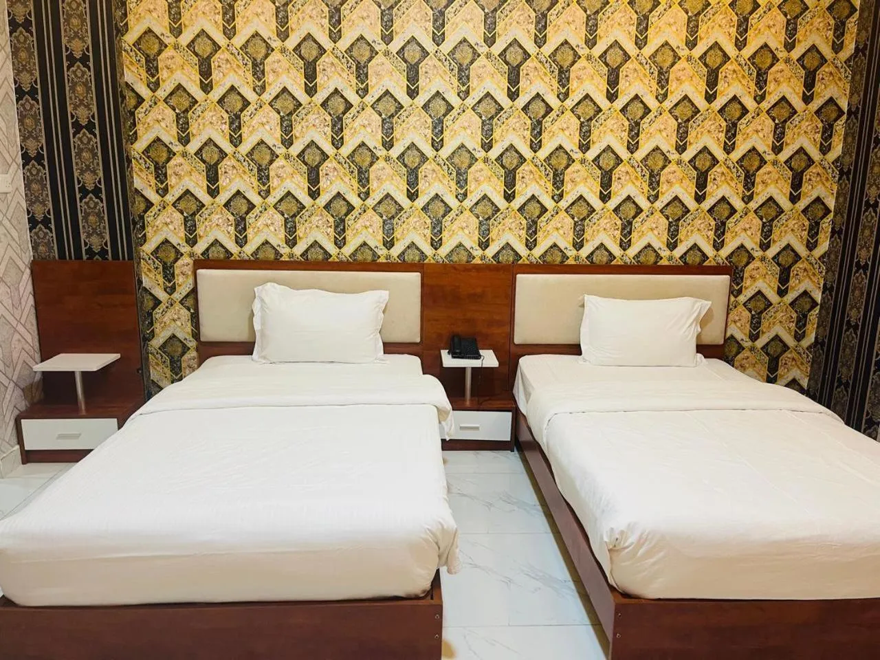 Bed in Grand Inn Hotel