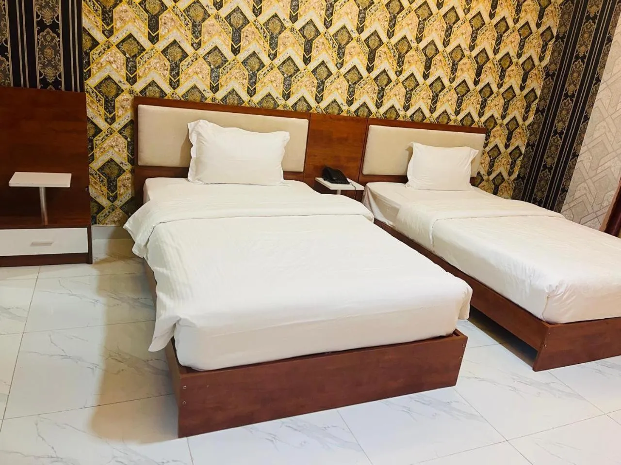 Bed in Grand Inn Hotel