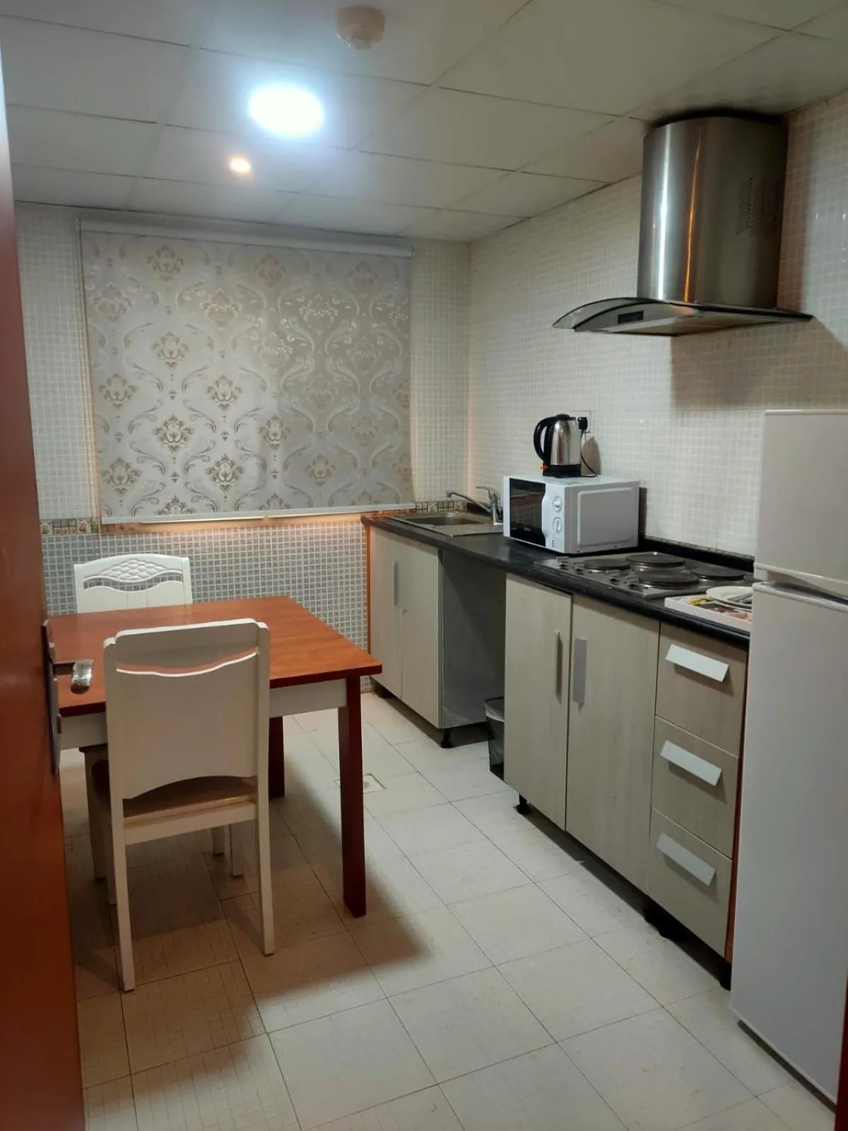 Kitchen or kitchenette in Grand Inn Hotel