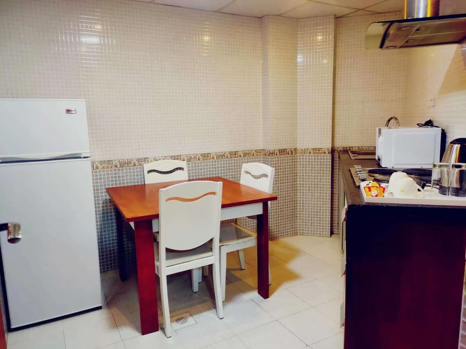 Kitchen or kitchenette in Grand Inn Hotel