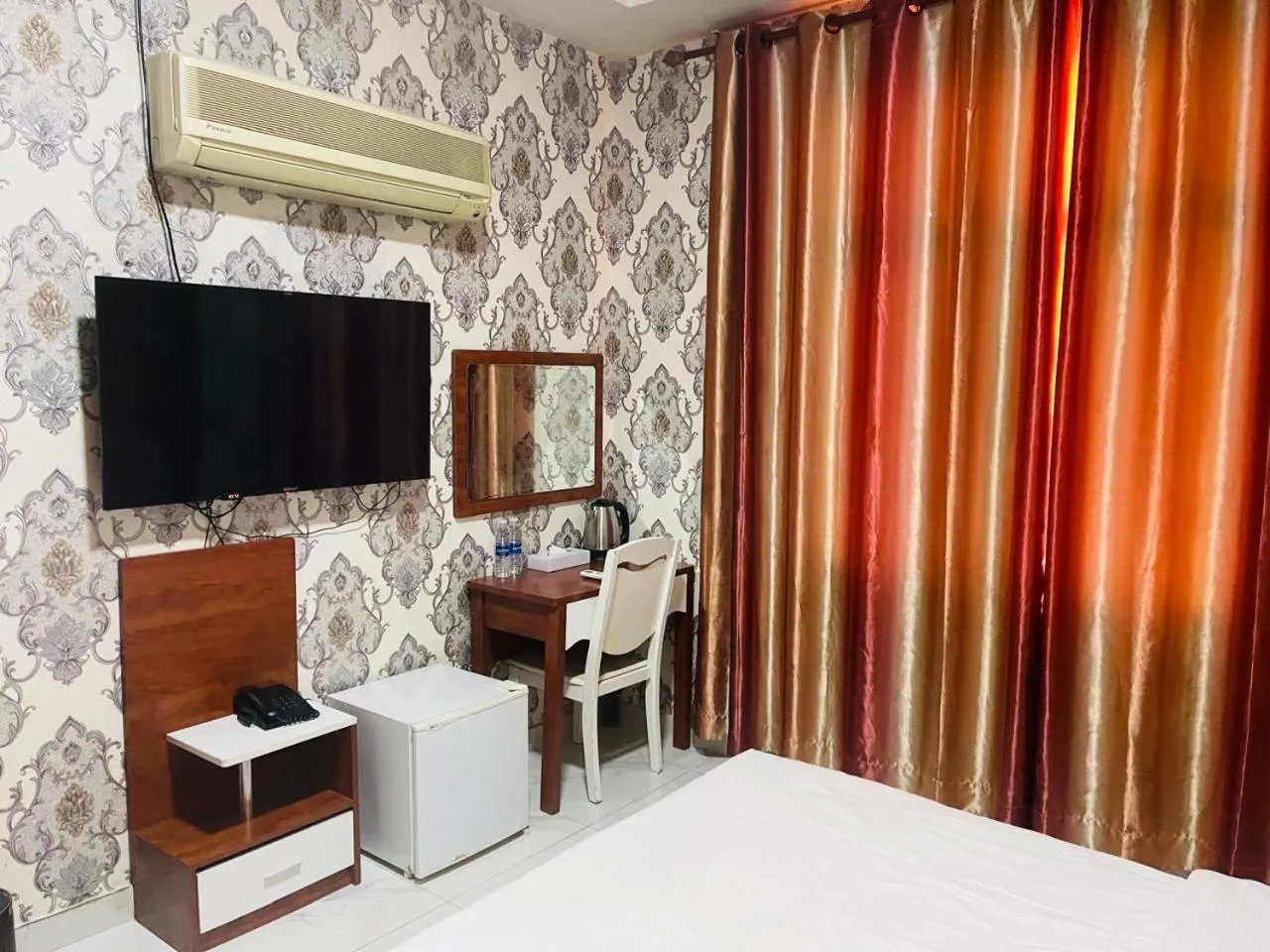 Bed in Grand Inn Hotel