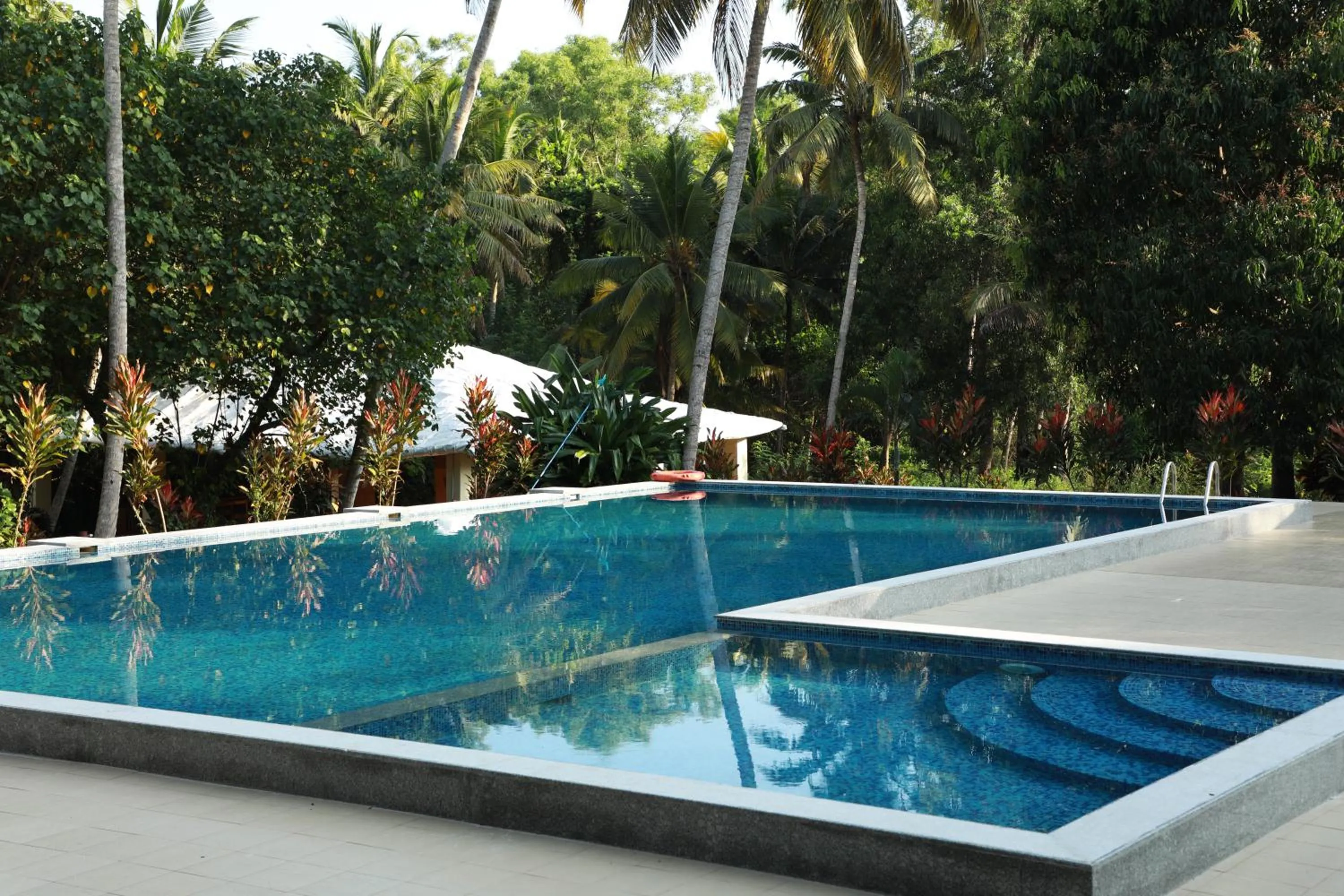 Swimming pool in Phoenix Island Resort Poovar