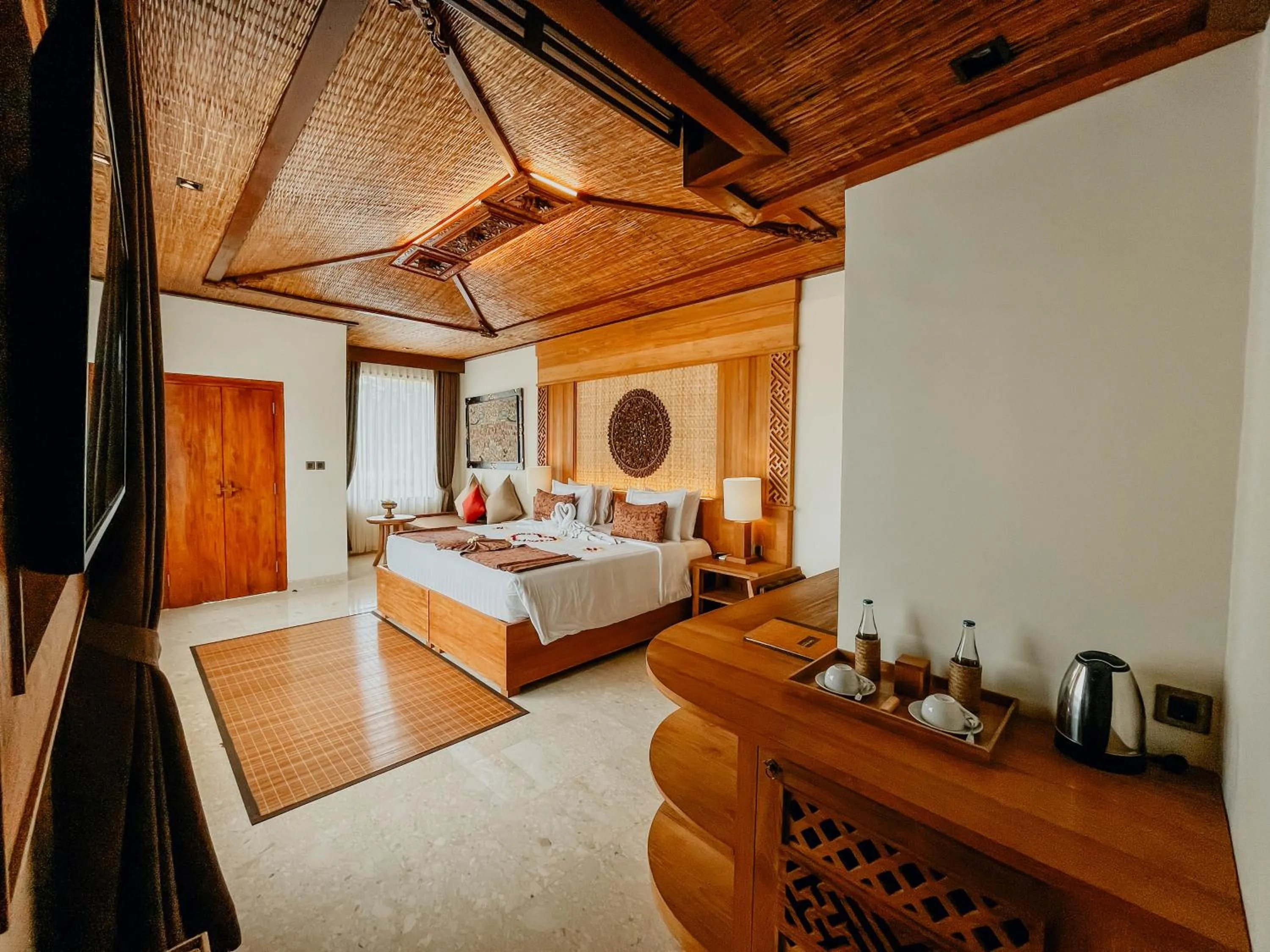 Bed in Sakti Garden Resort & Spa