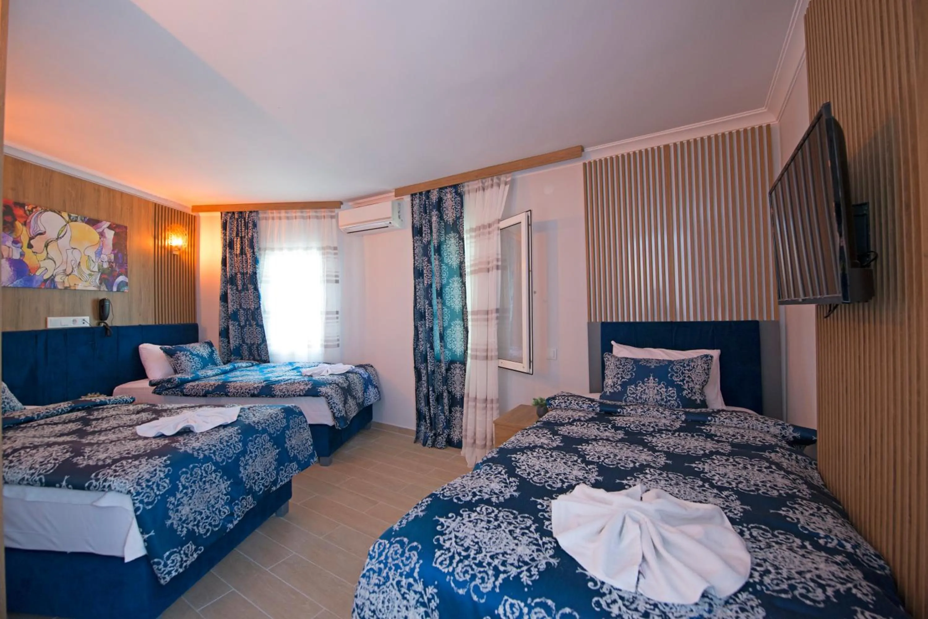 Bed in Blue Bay Beach Hotel