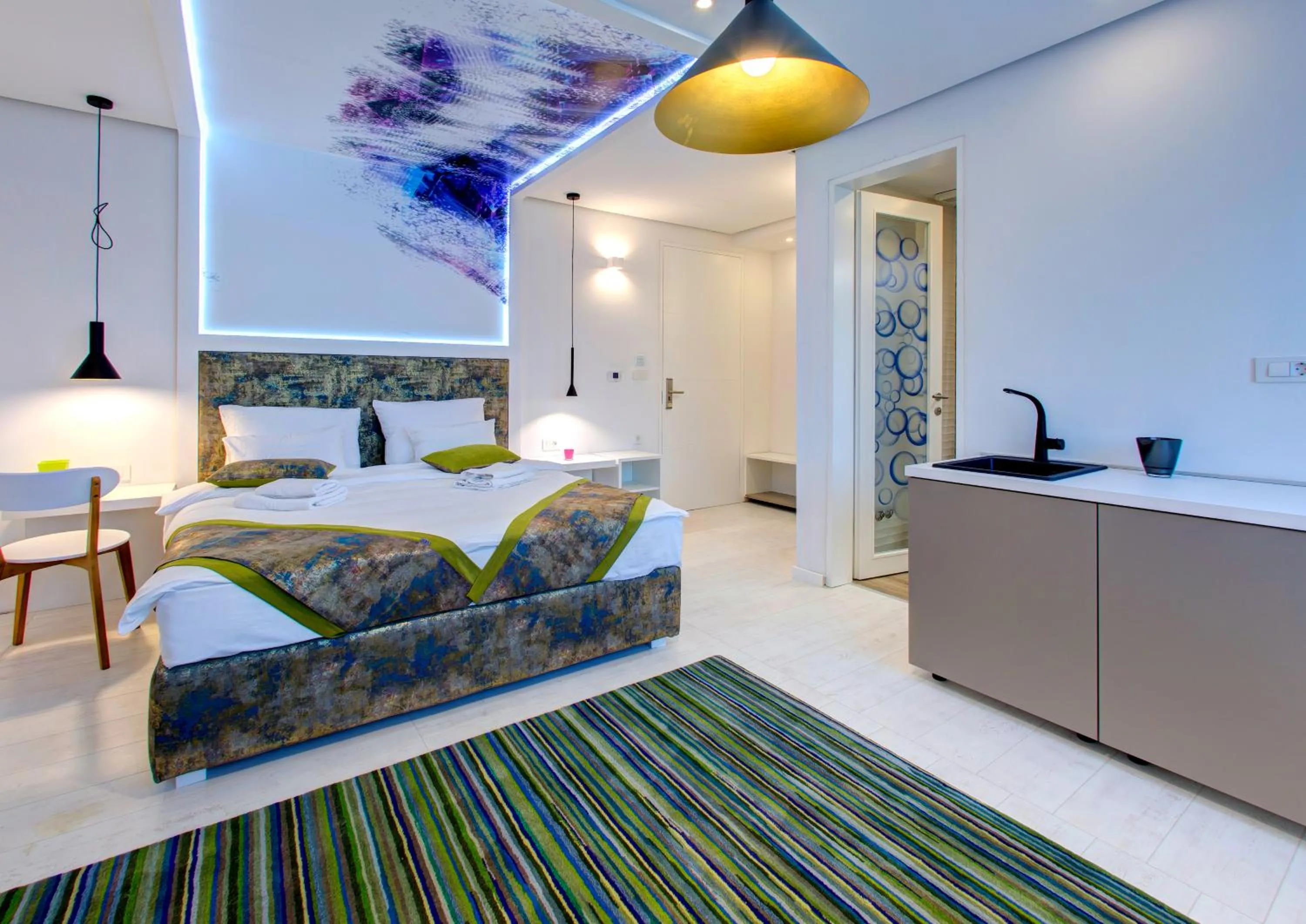 Bed in Diamond Rain Boutique Hotel