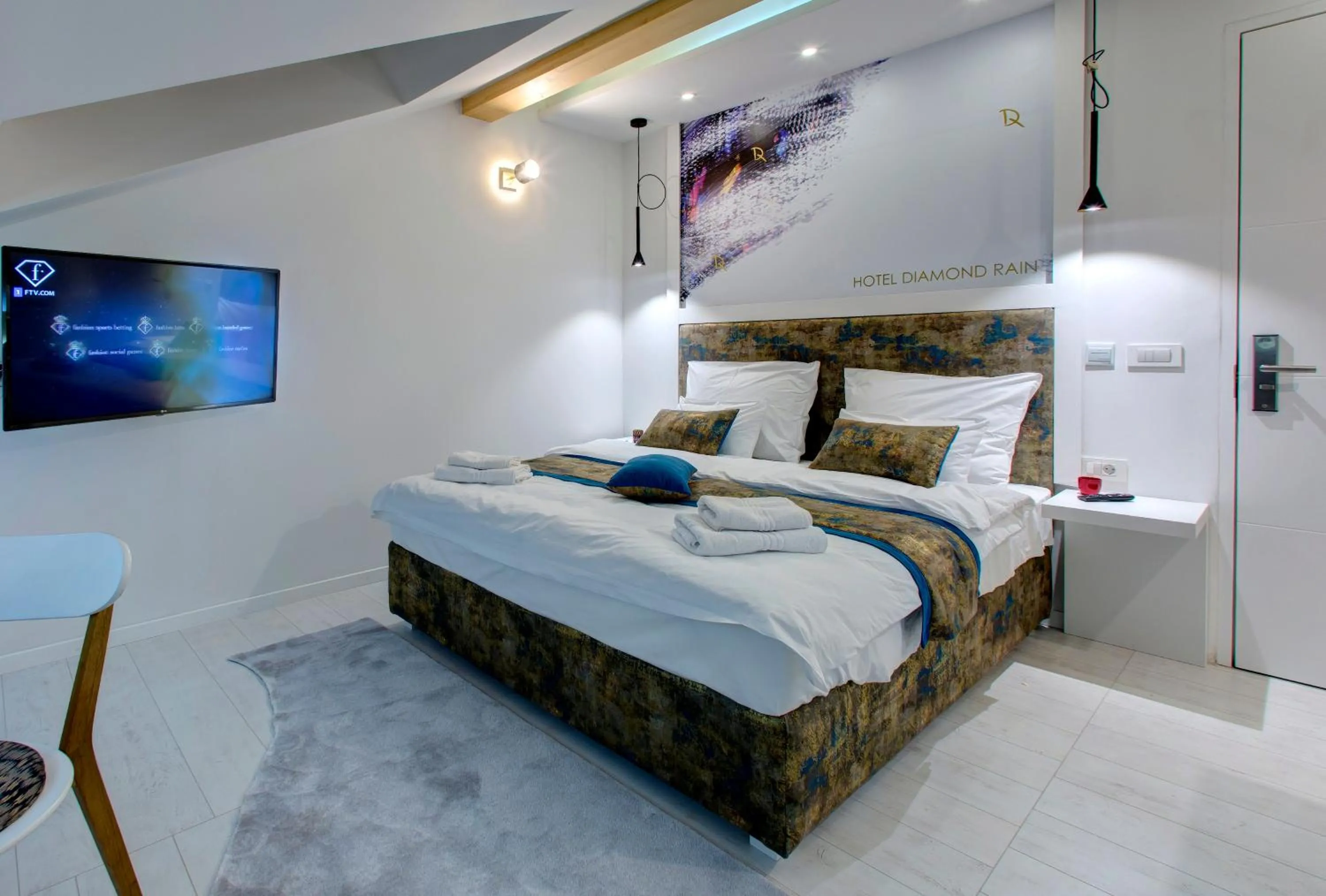 Bed in Diamond Rain Boutique Hotel