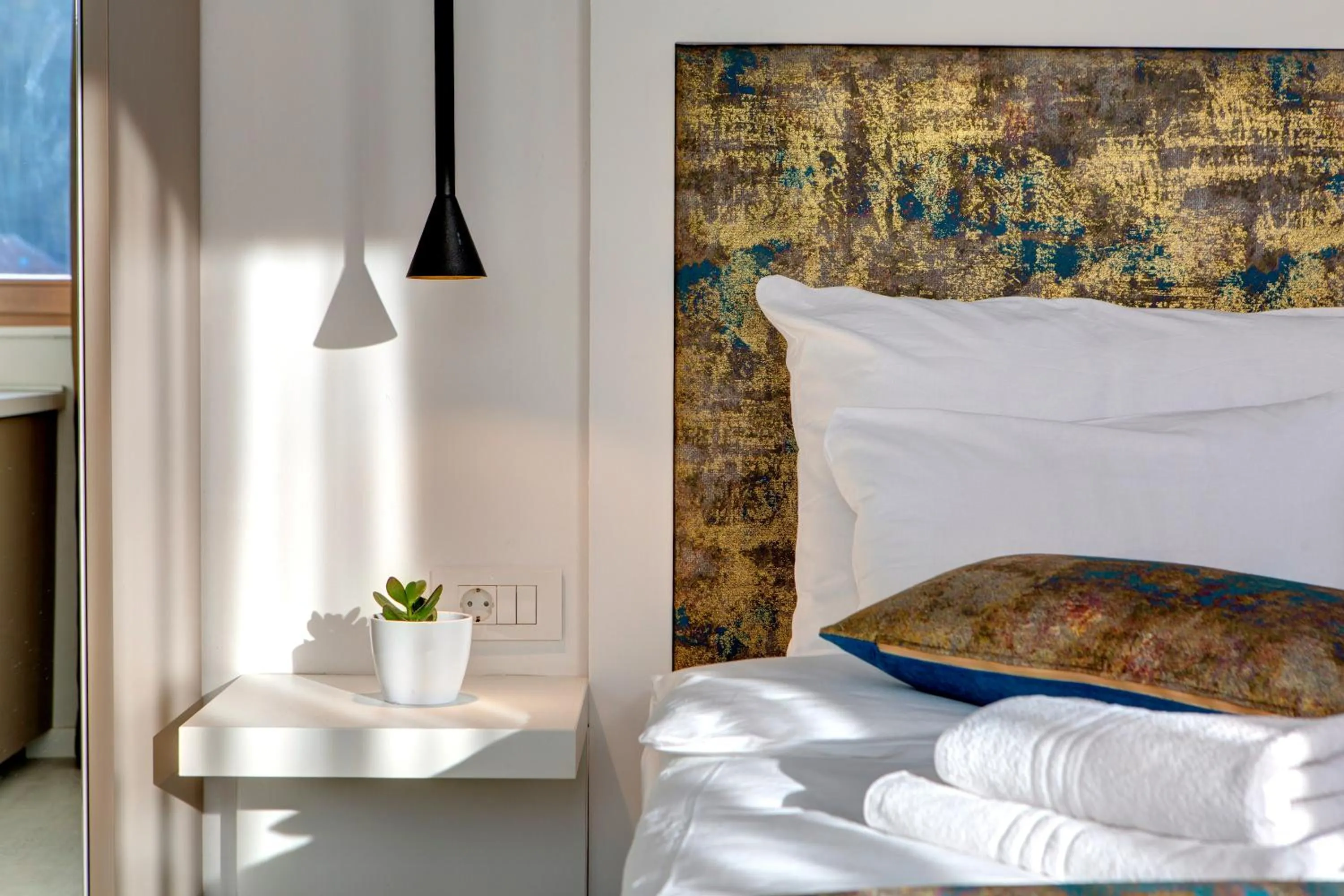 Bed in Diamond Rain Boutique Hotel