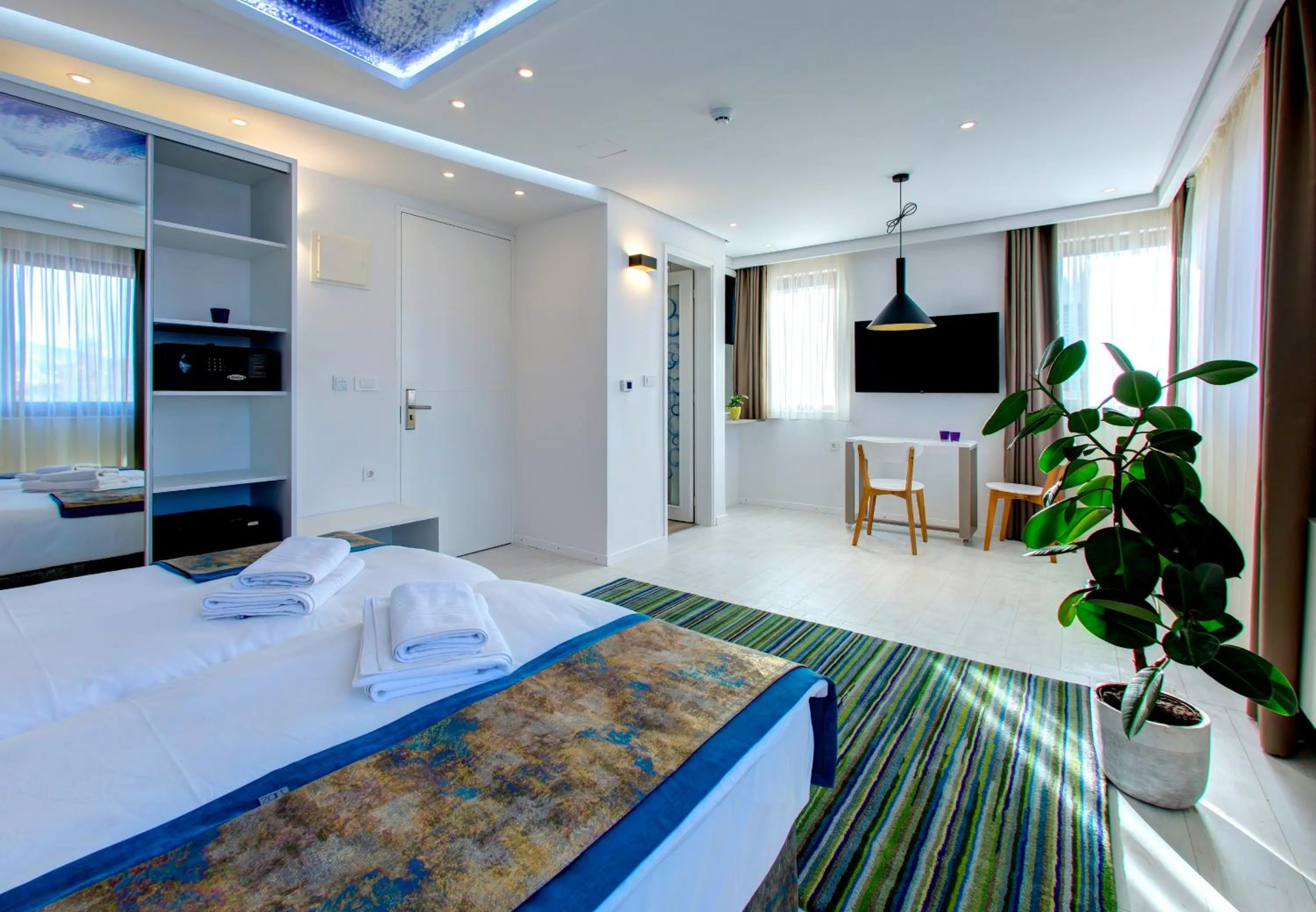 Bed in Diamond Rain Boutique Hotel