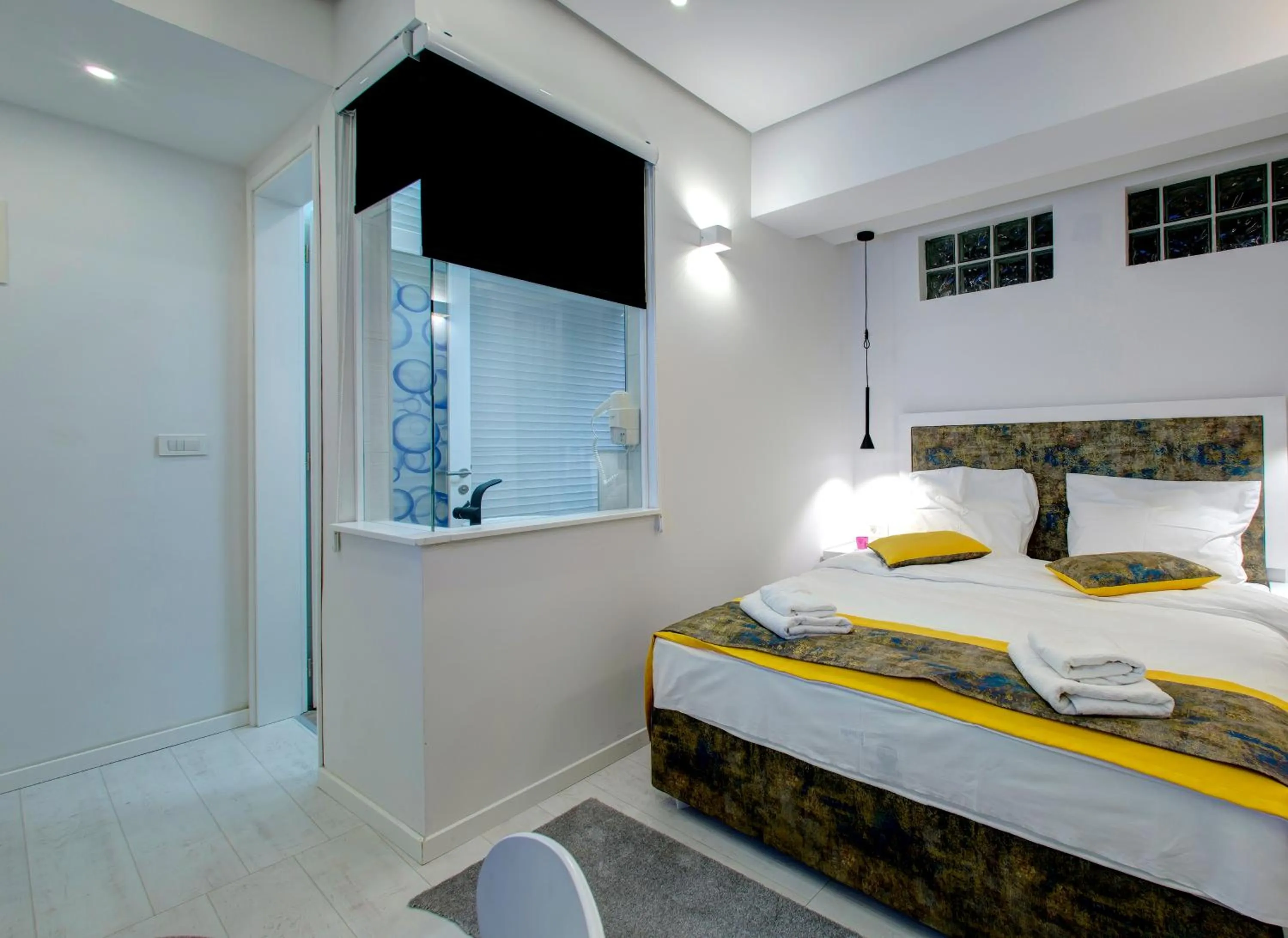 Bed in Diamond Rain Boutique Hotel