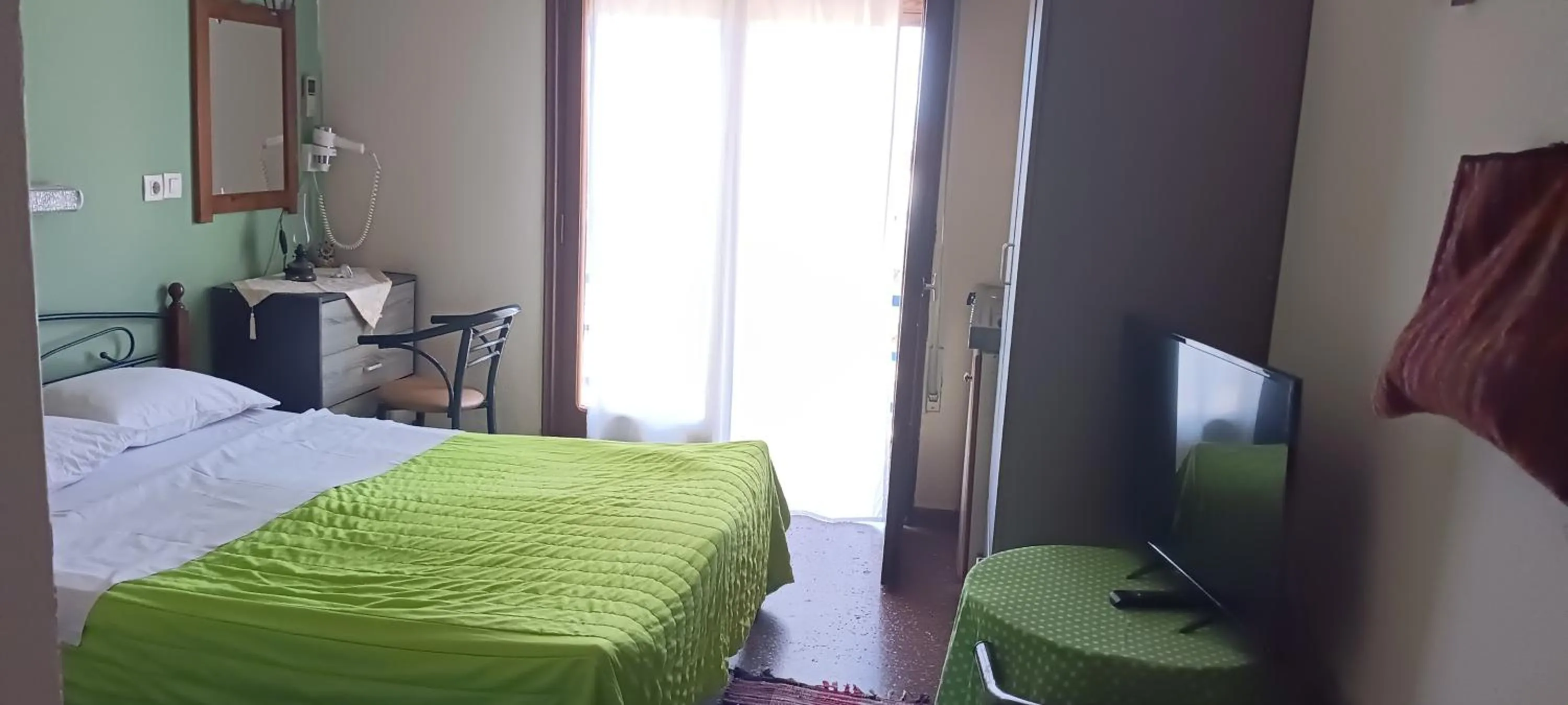 Bed in Hotel zakros rooms-restaurant