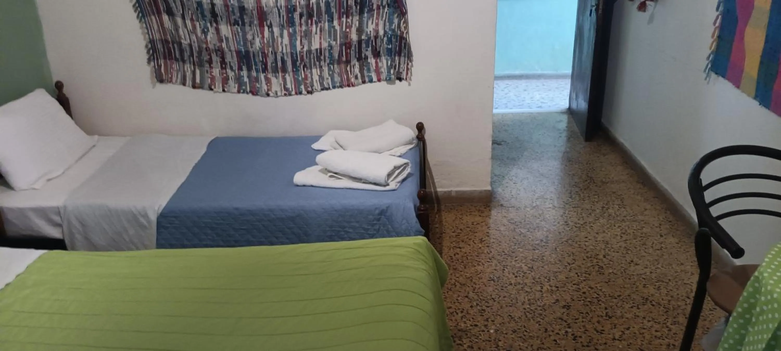 Bed in Hotel zakros rooms-restaurant