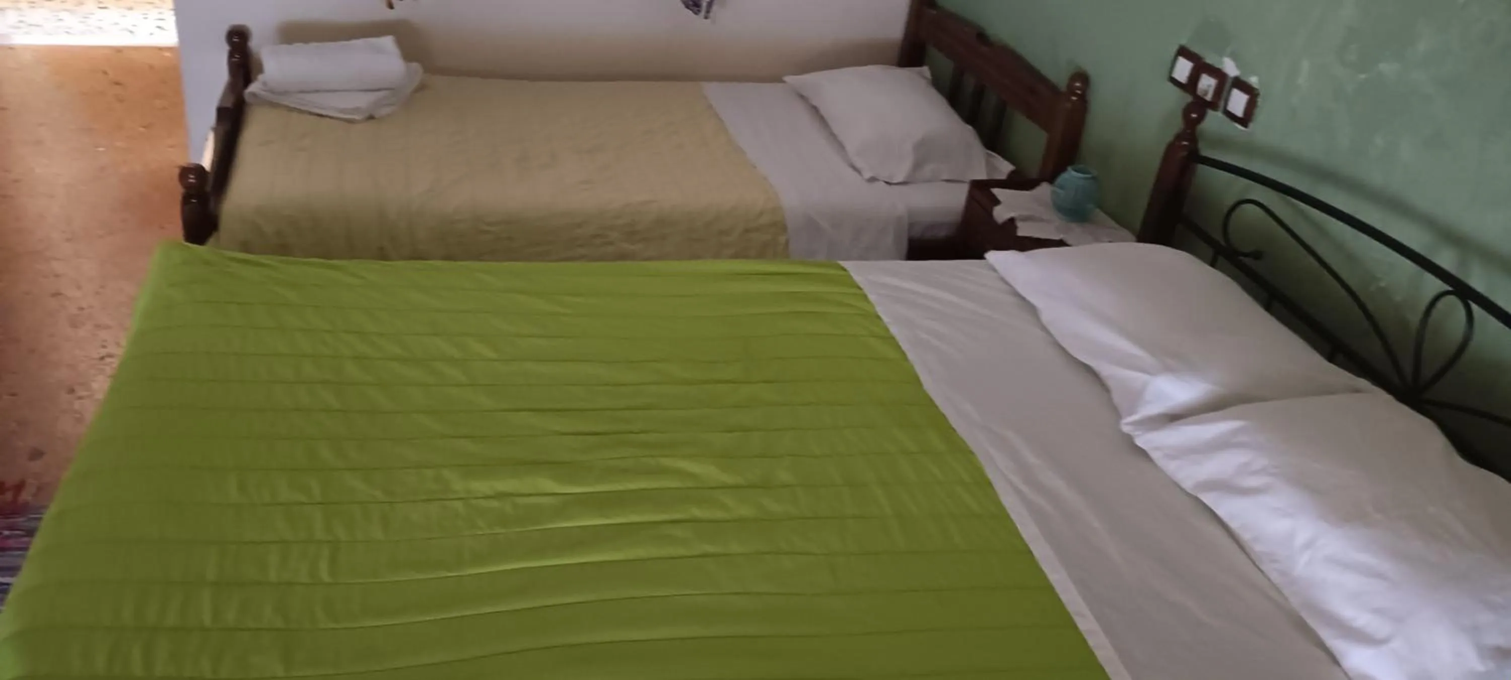 Bed in Hotel zakros rooms-restaurant