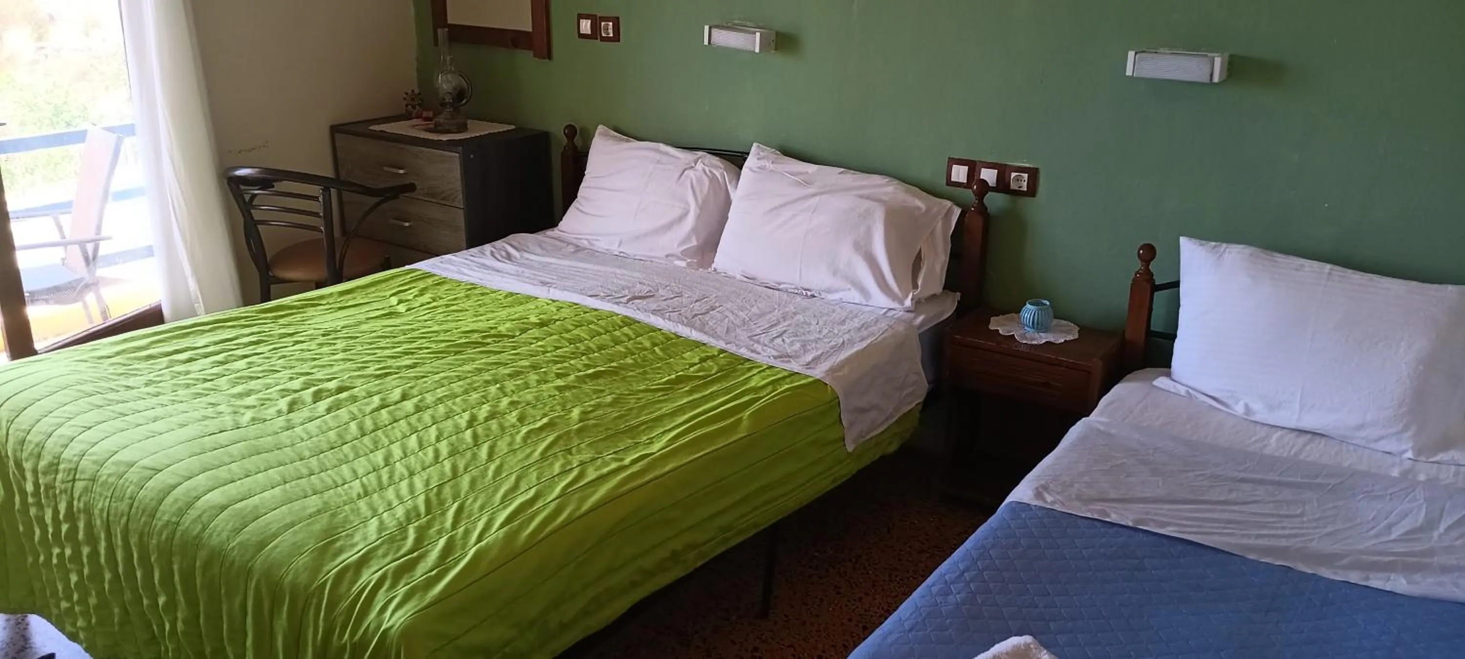 Bed in Hotel zakros rooms-restaurant