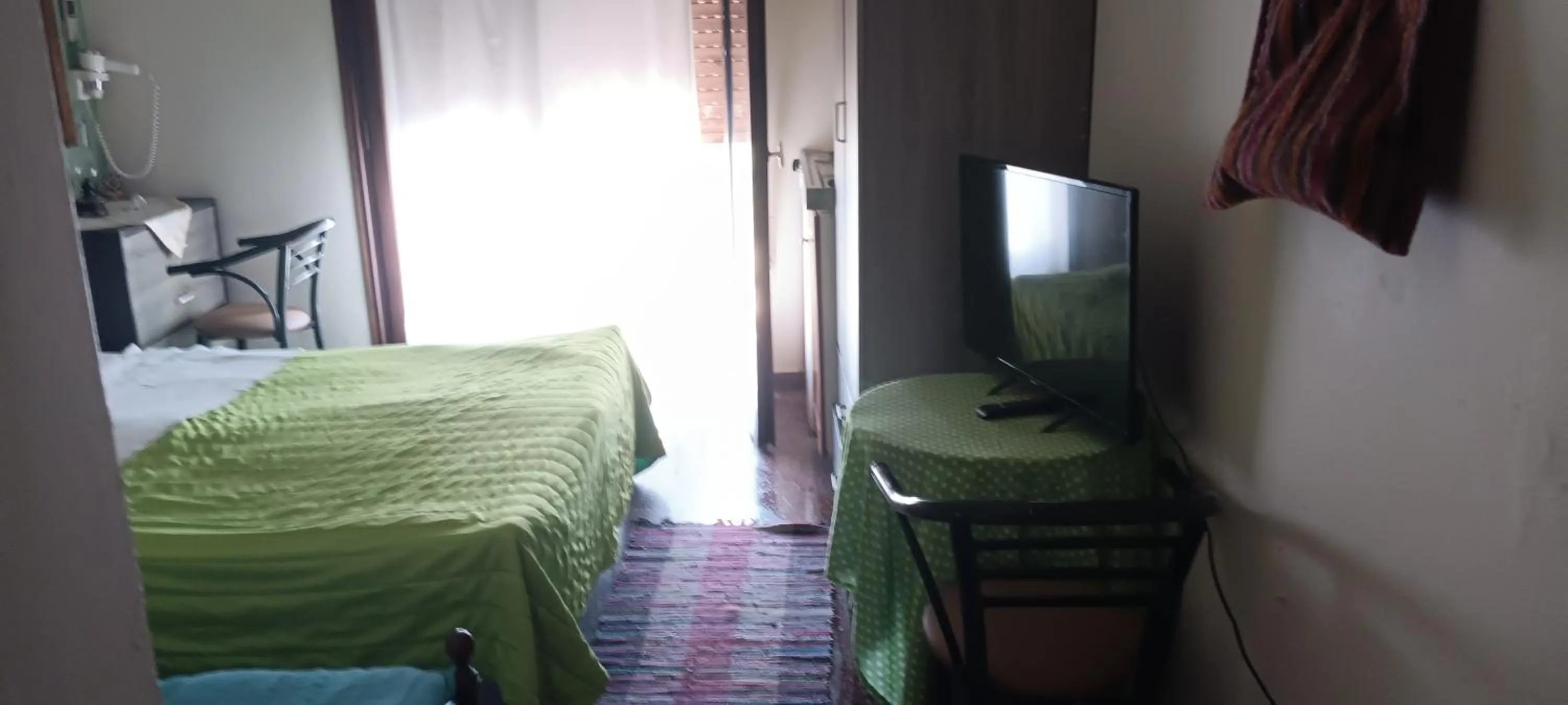 Bed in Hotel zakros rooms-restaurant