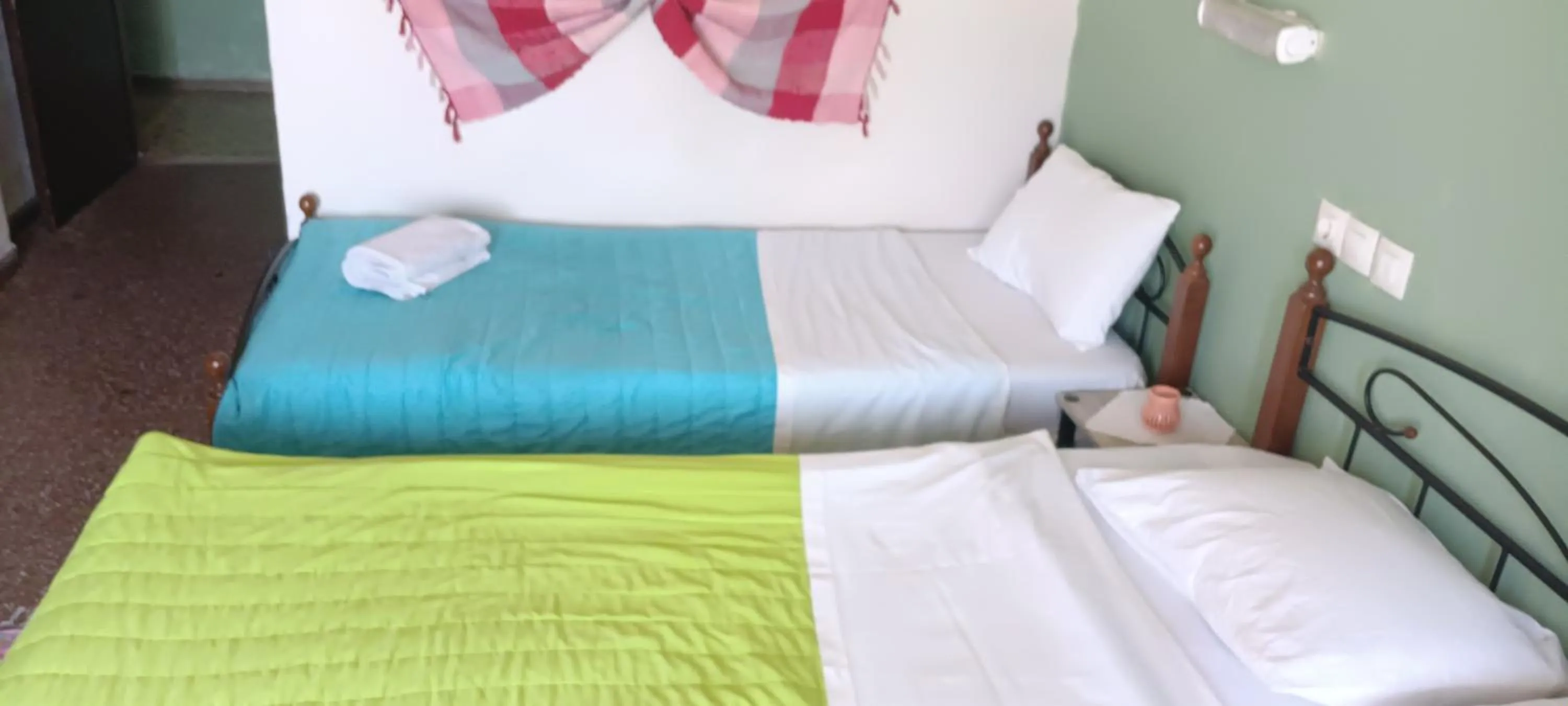 Bed in Hotel zakros rooms-restaurant