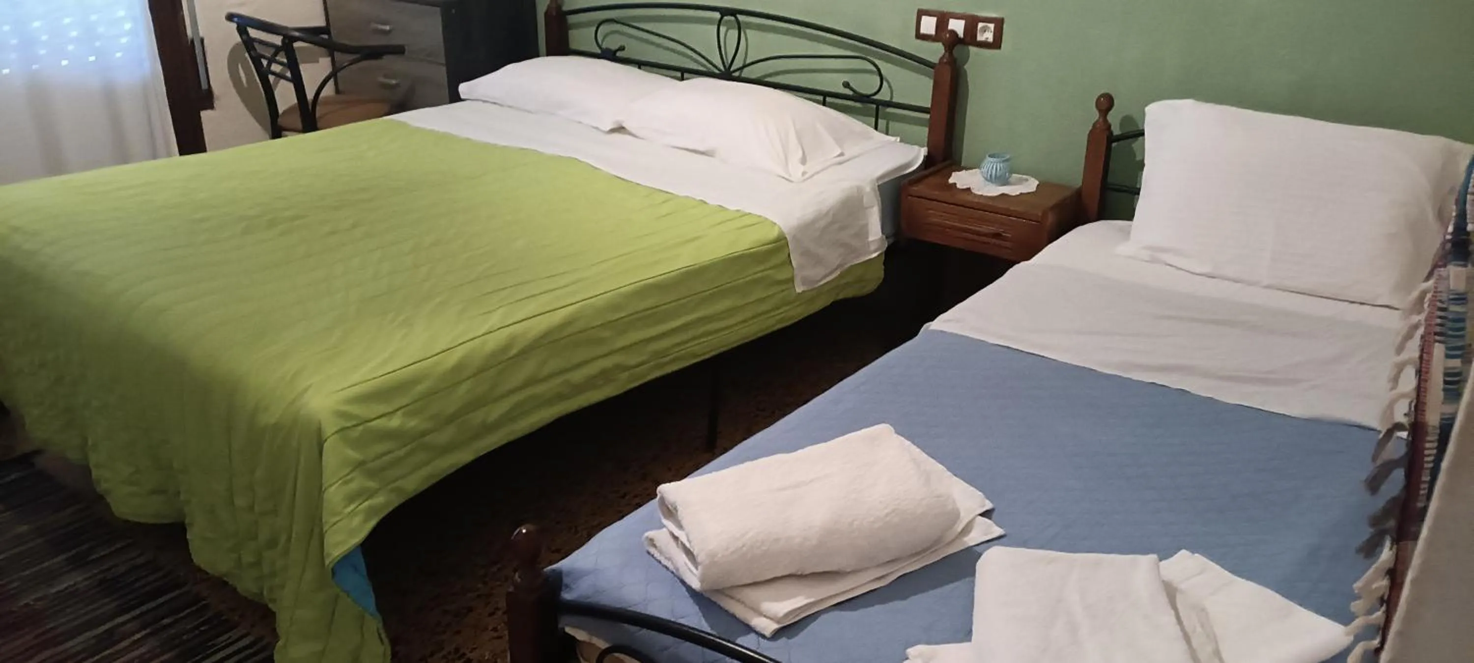 Bed in Hotel zakros rooms-restaurant