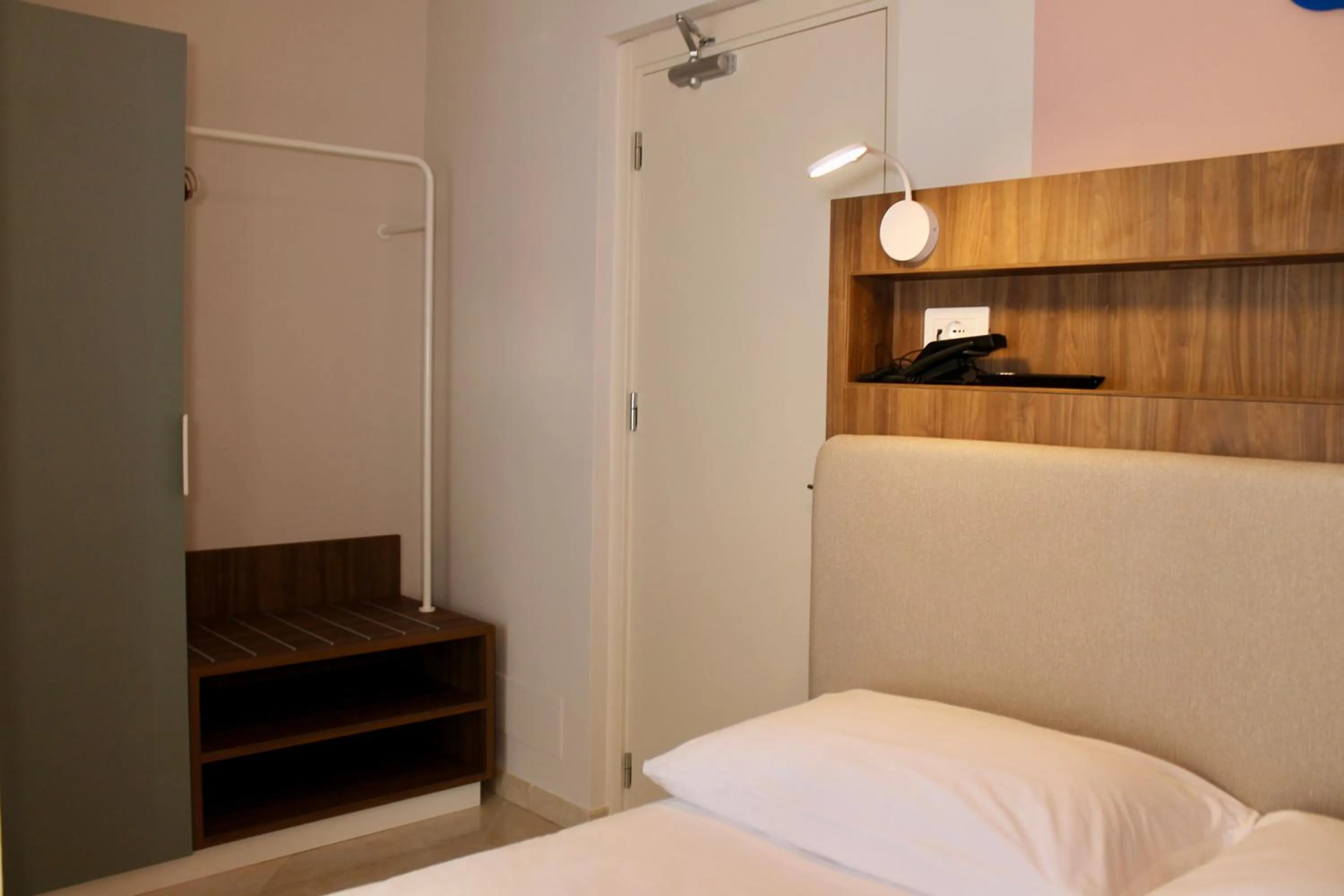 Bed in La Vista Postcard Hotel