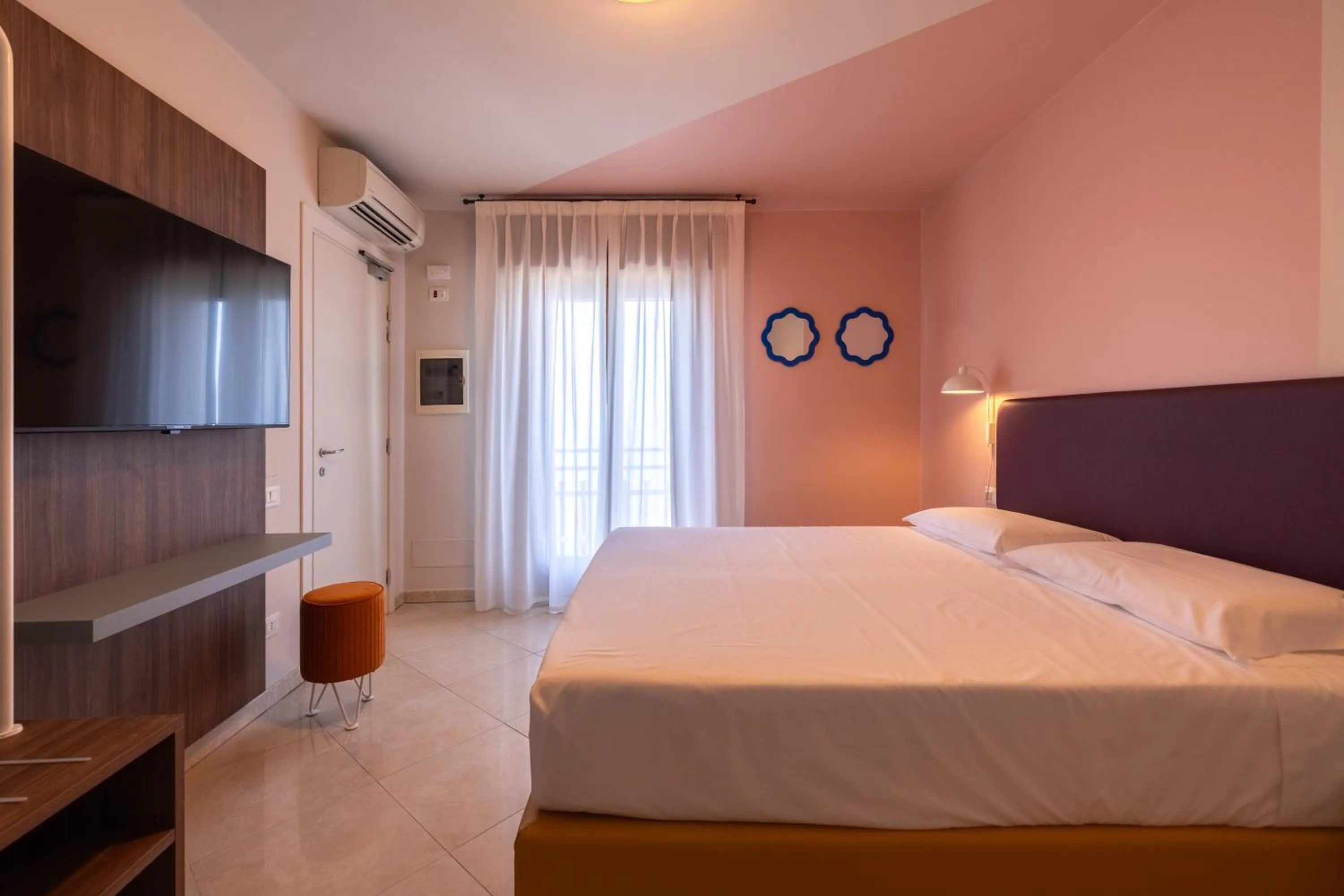 Bed in La Vista Postcard Hotel