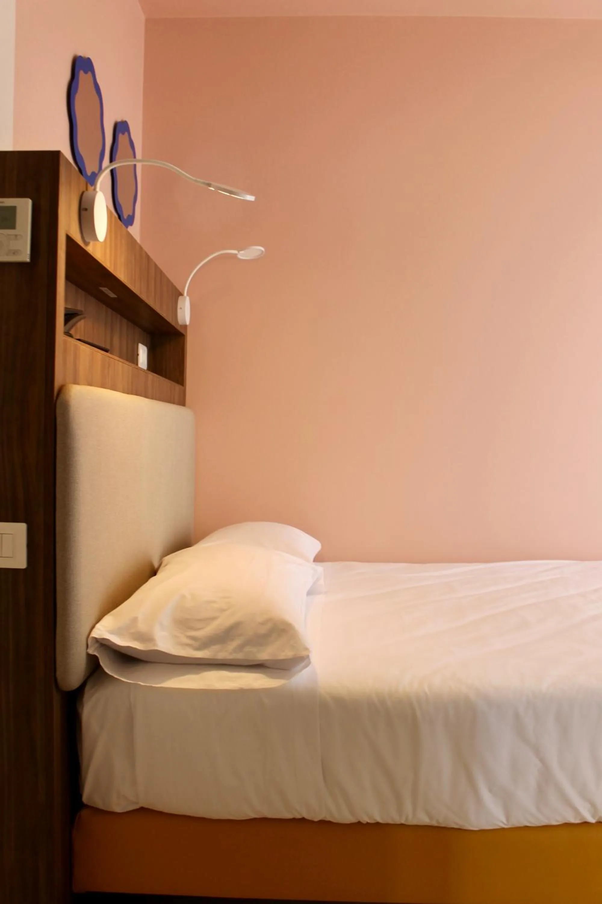 Bed in La Vista Postcard Hotel