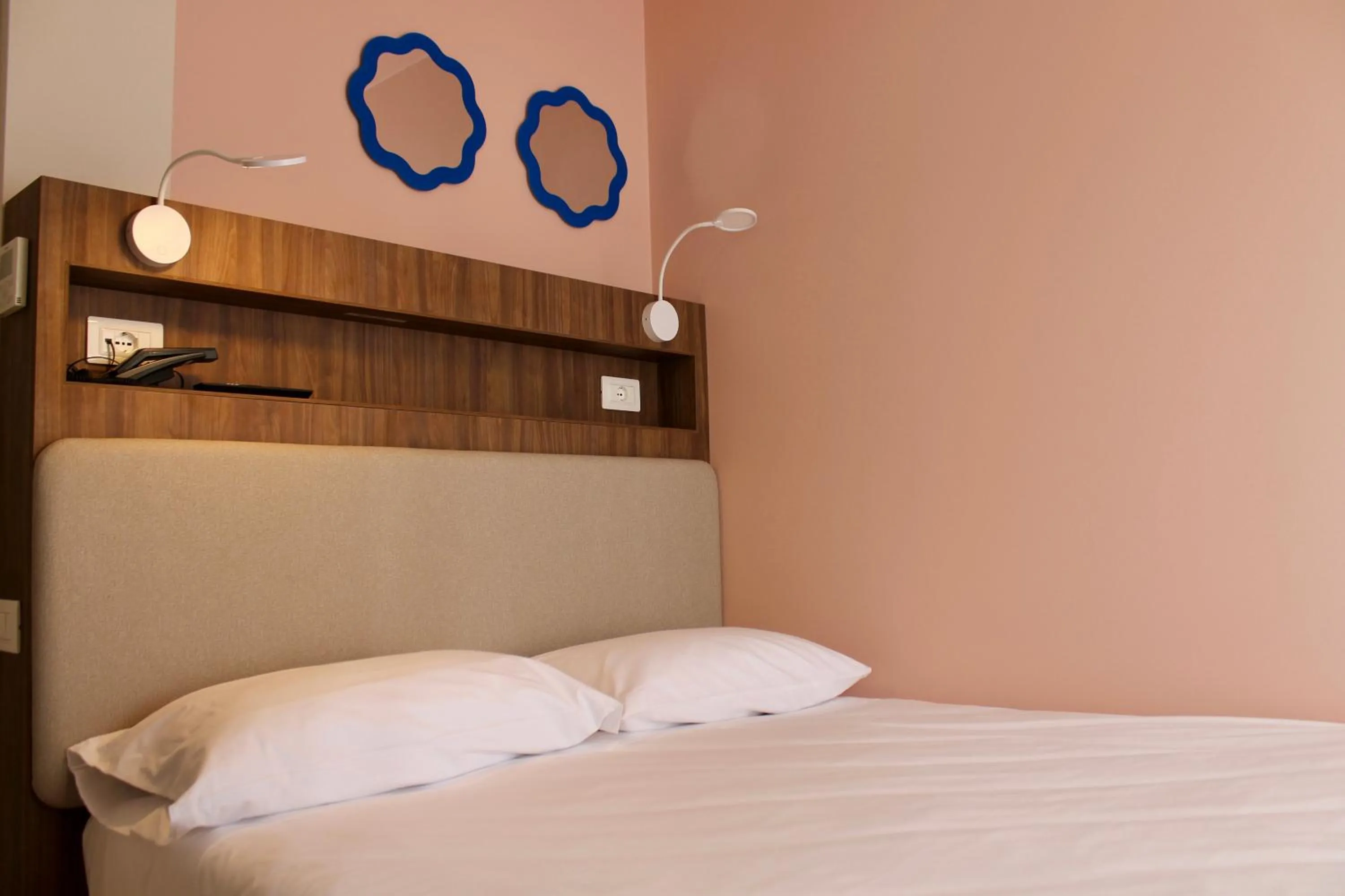 Bed in La Vista Postcard Hotel