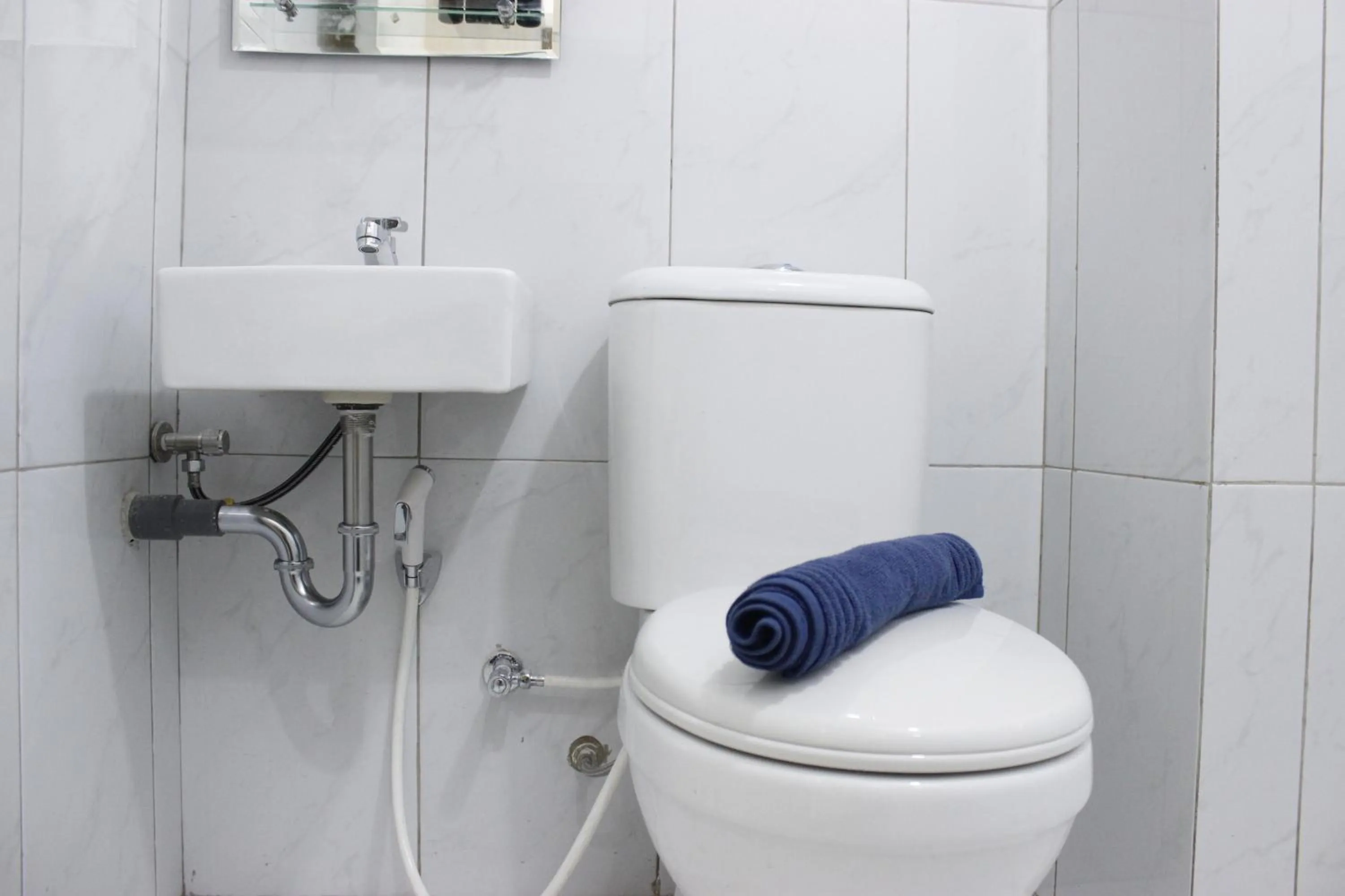 Bathroom in Monochrome Style Studio Room @Grand Asia Afrika Apartment By Travelio