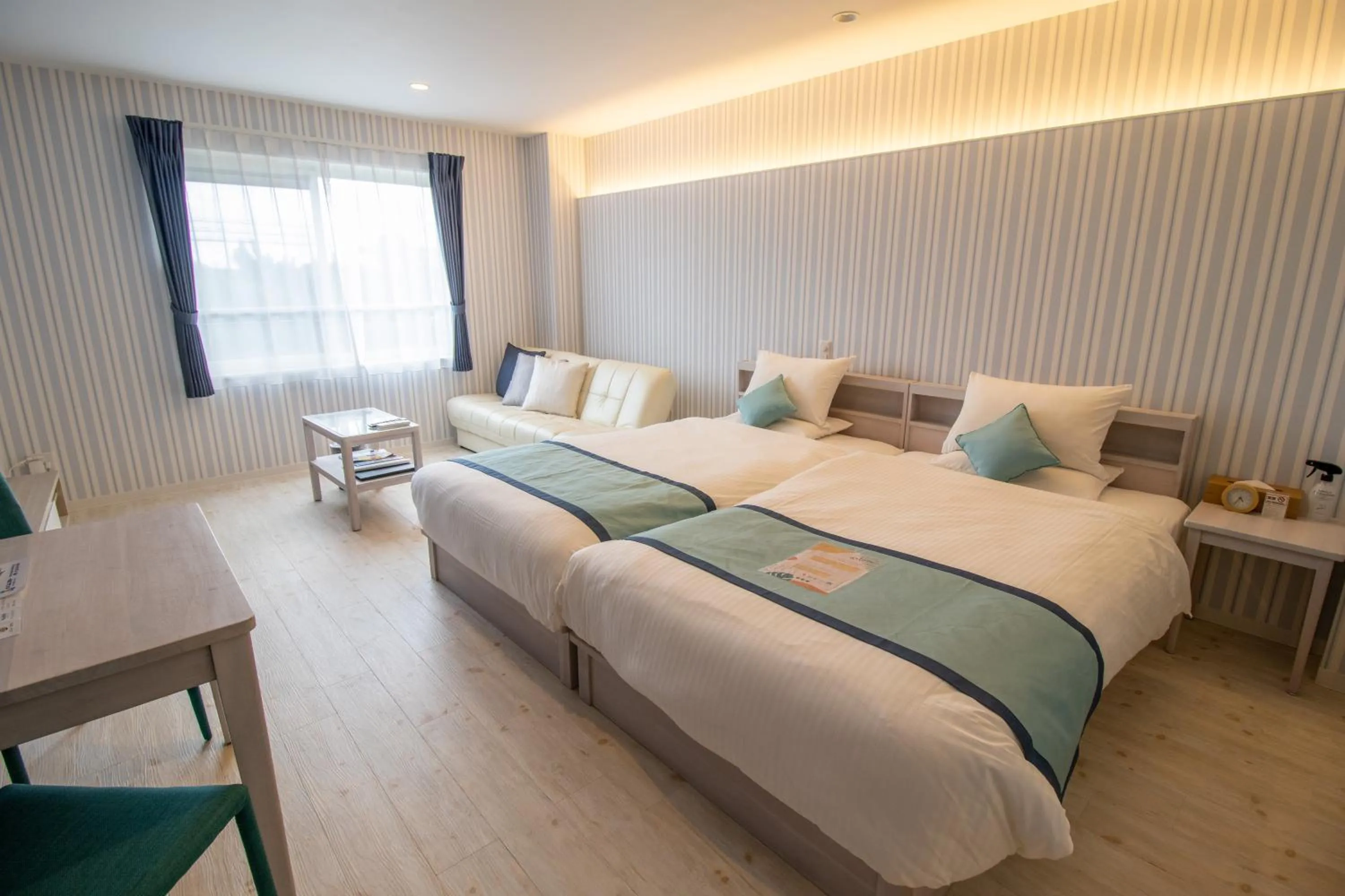 Bed in Pine Hills Hotel Miyakojima