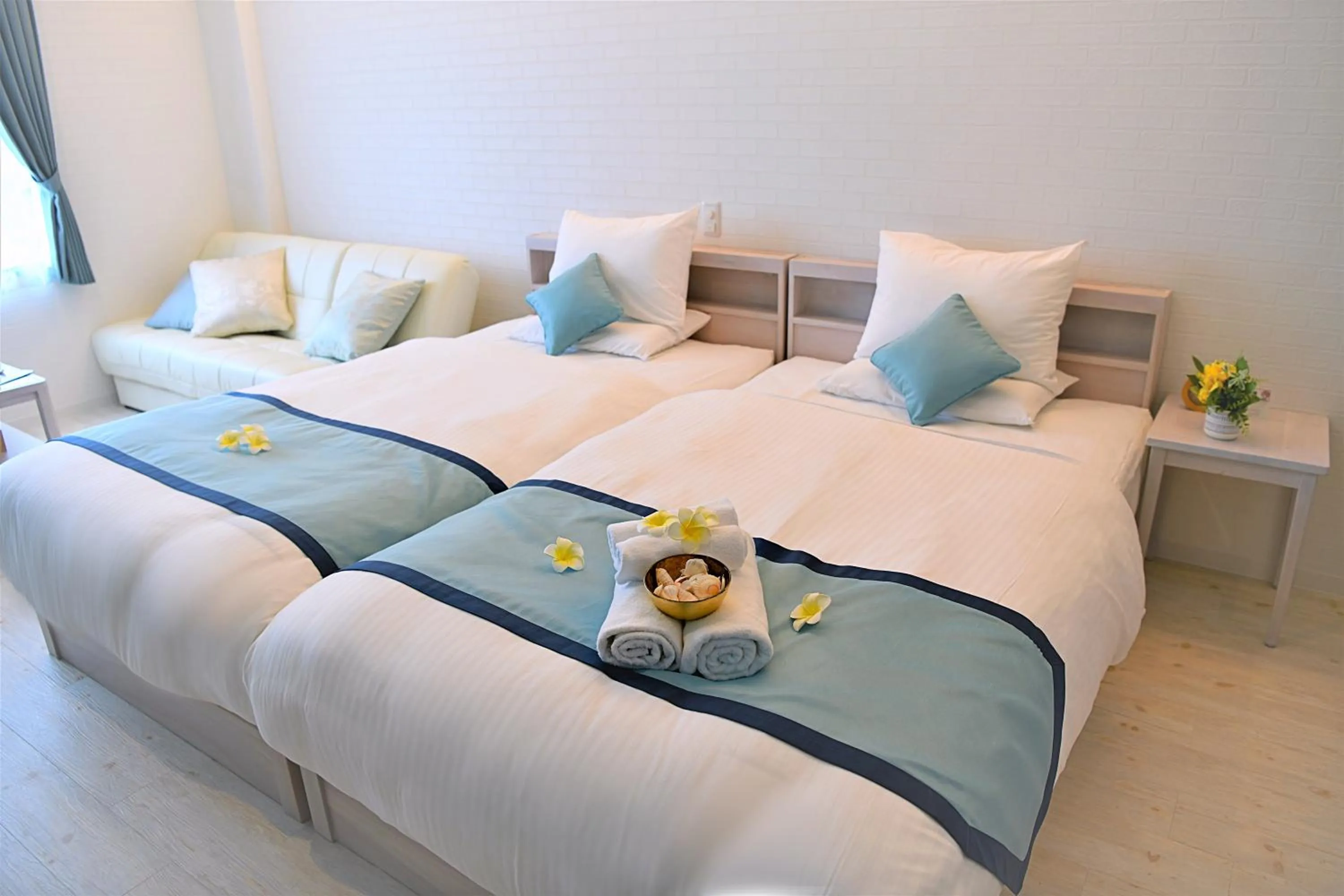 Bed in Pine Hills Hotel Miyakojima