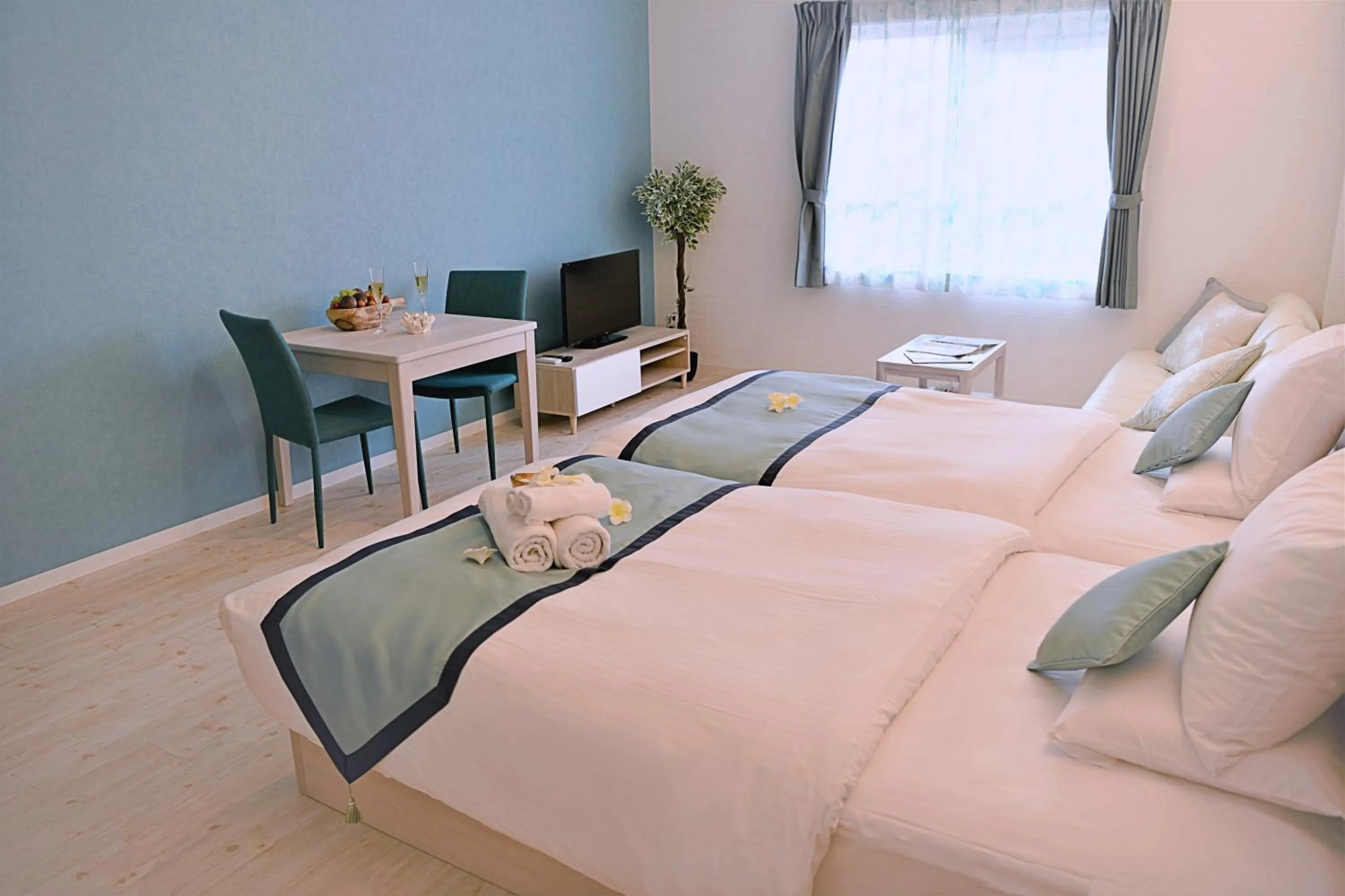 Bed in Pine Hills Hotel Miyakojima