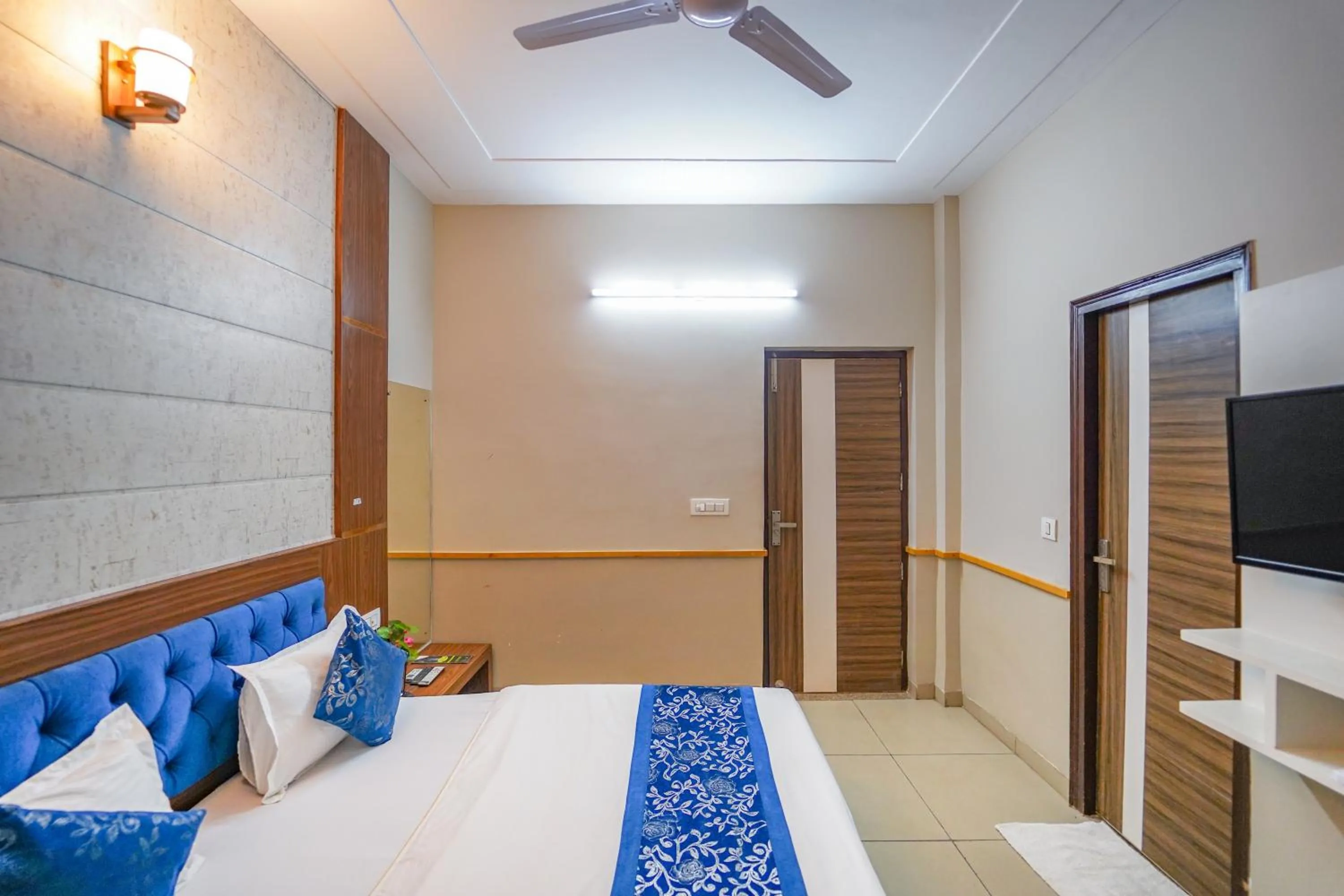 Bed in Vrinda Anandam Resort