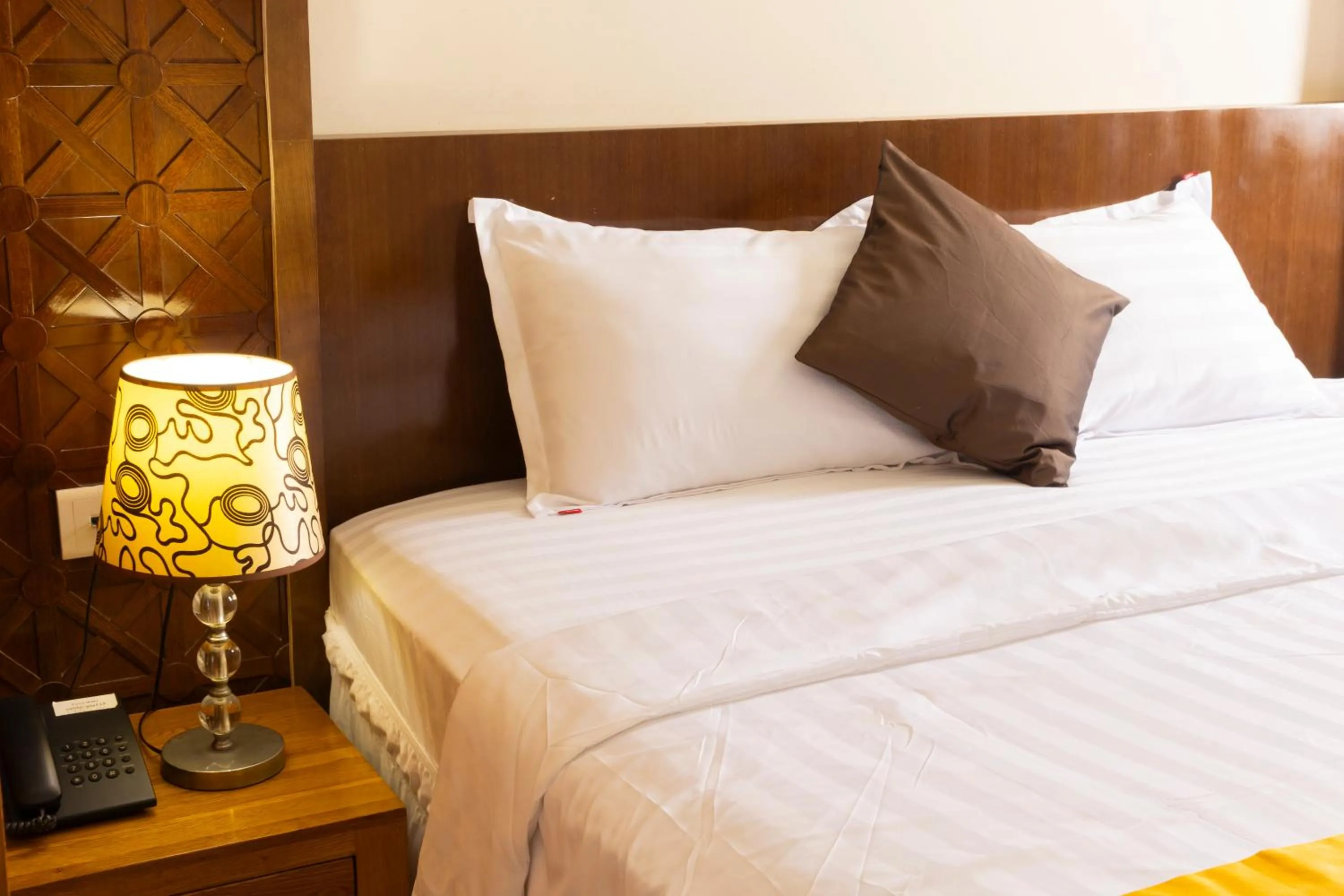 Bed in California Saigon Hotel