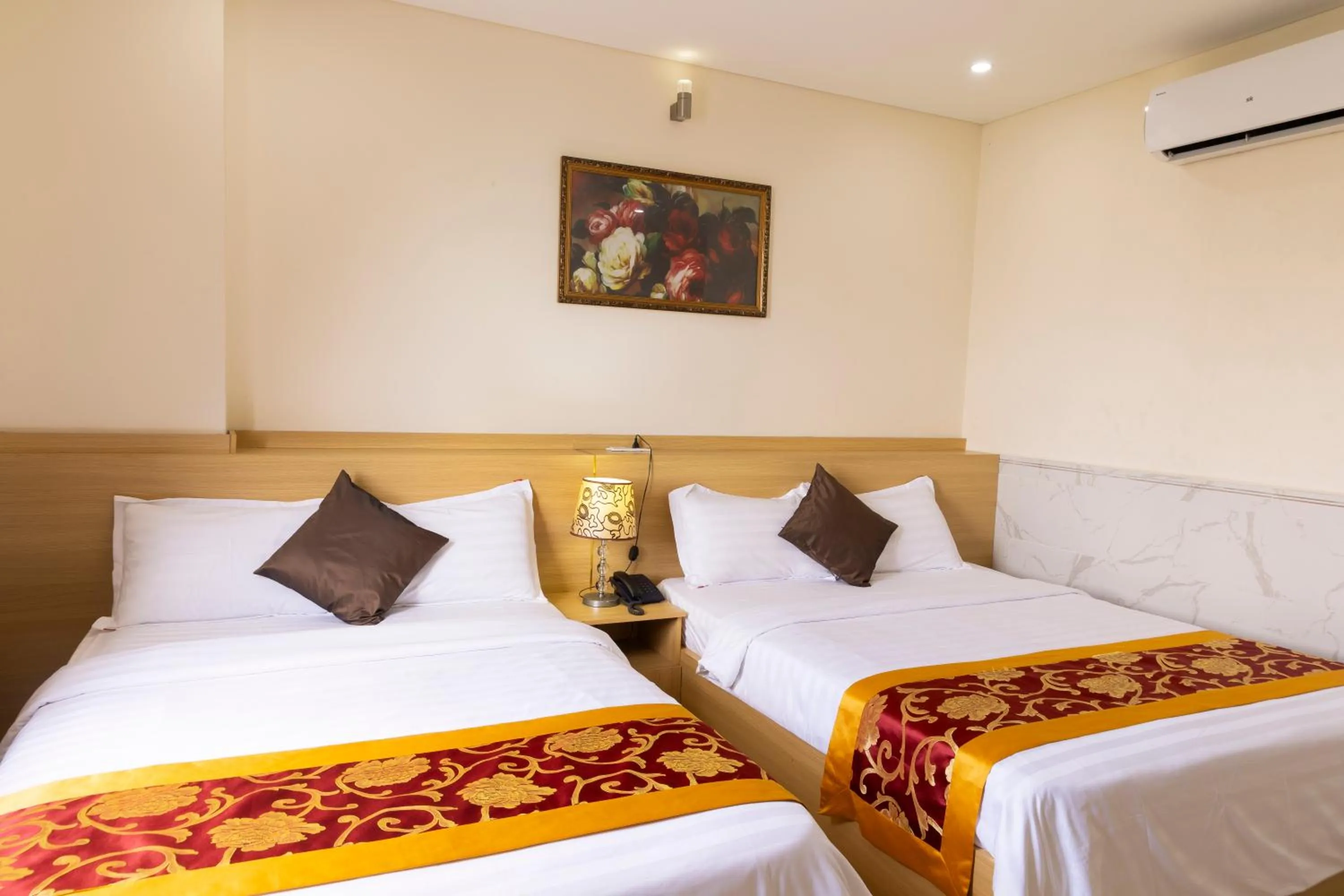 Bed in California Saigon Hotel