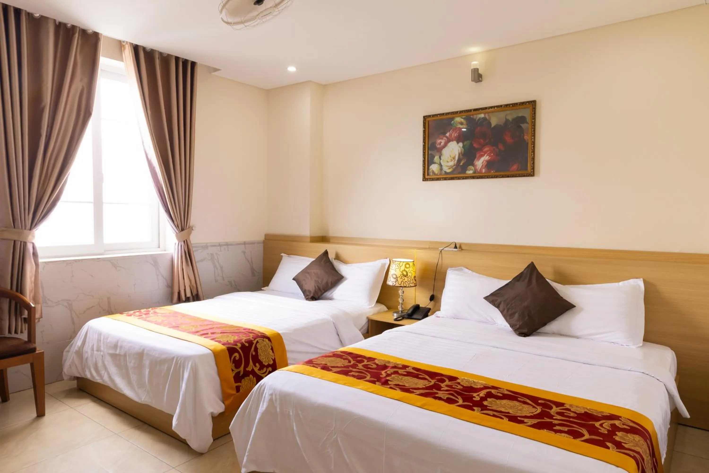 Bed in California Saigon Hotel