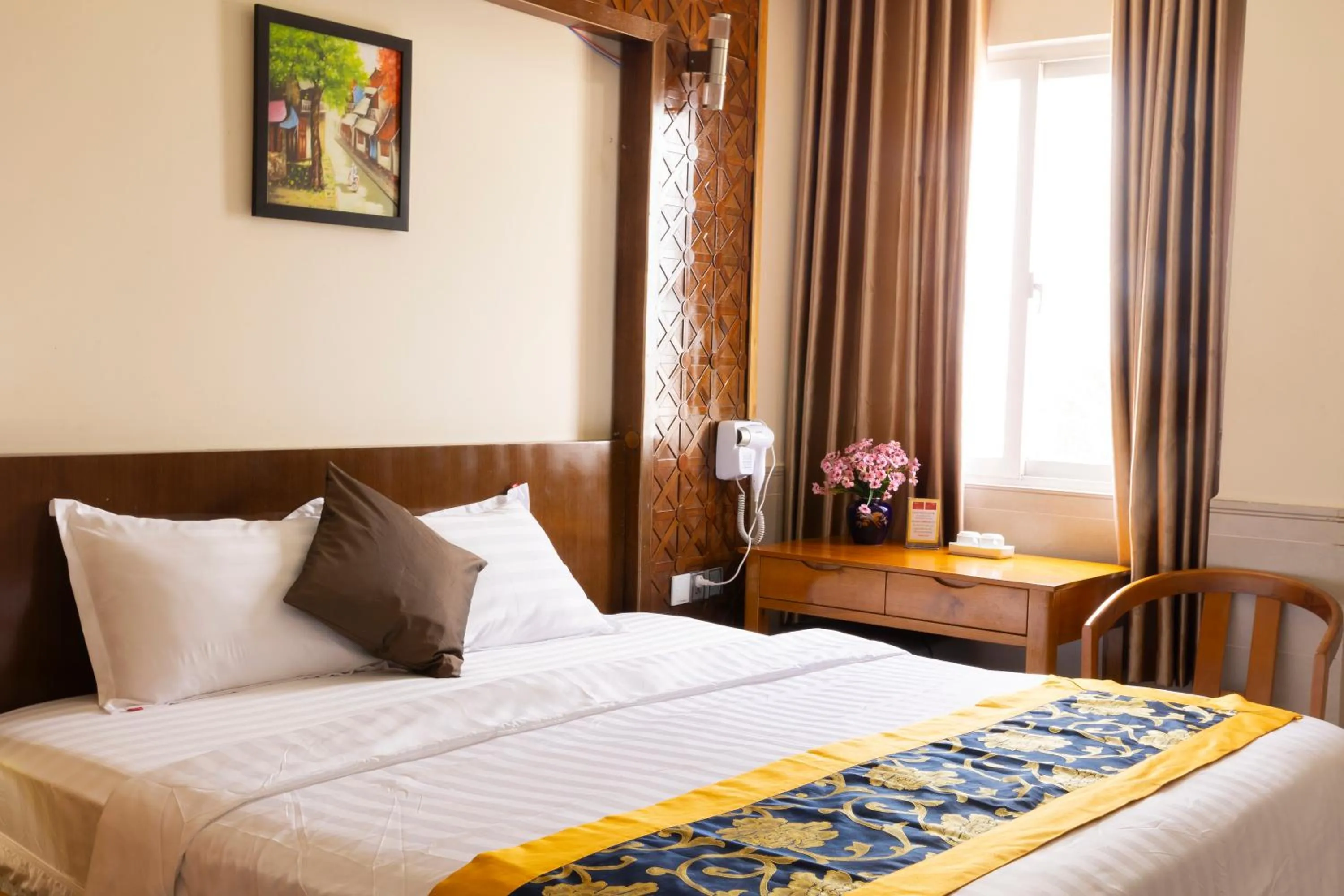 Bed in California Saigon Hotel