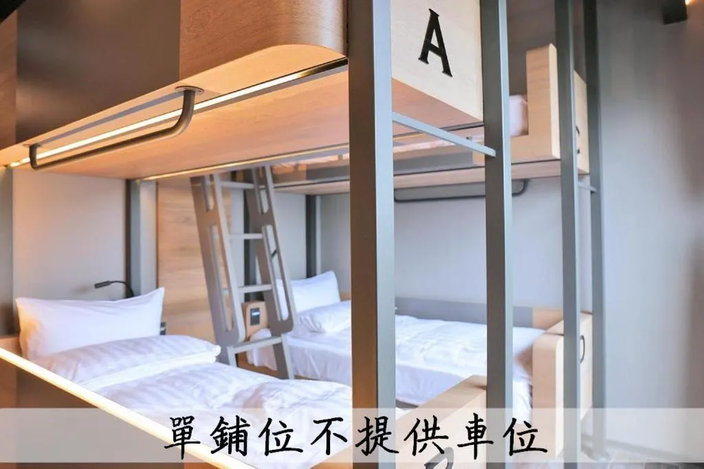 Bed in KIWI SHARE HOTEL ZHONGLI