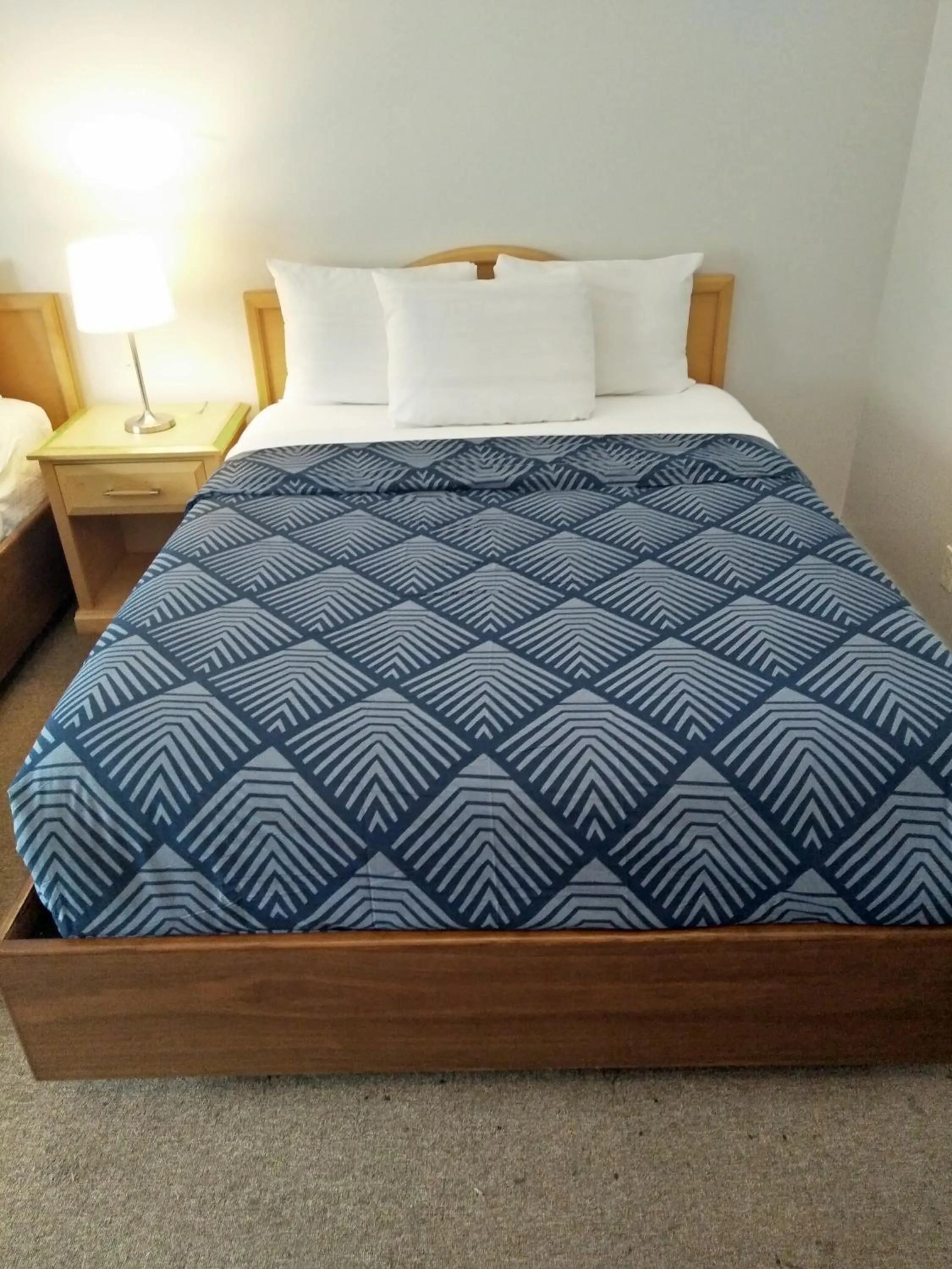 Bed in Sundowner Motel