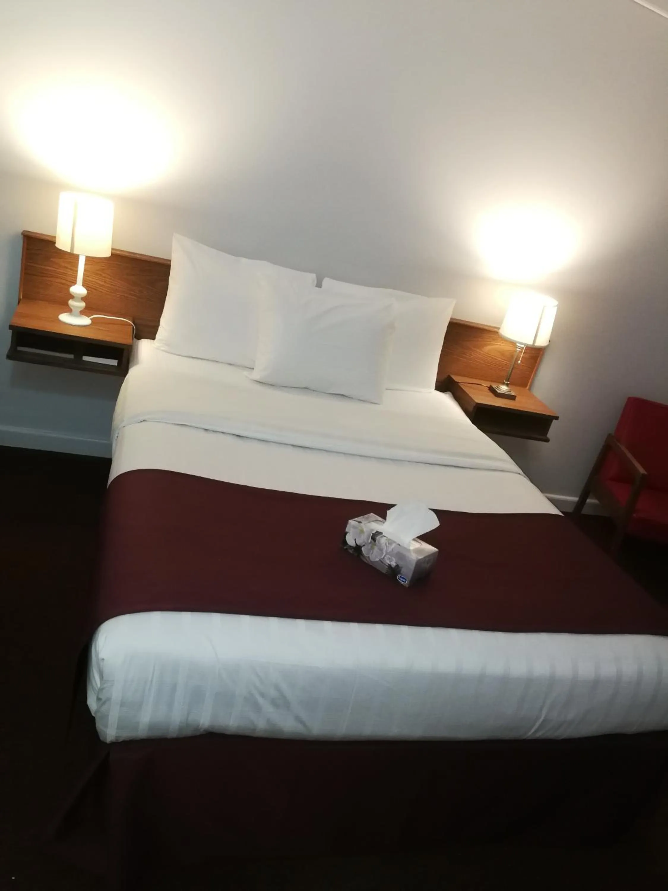 Bed in Sundowner Motel