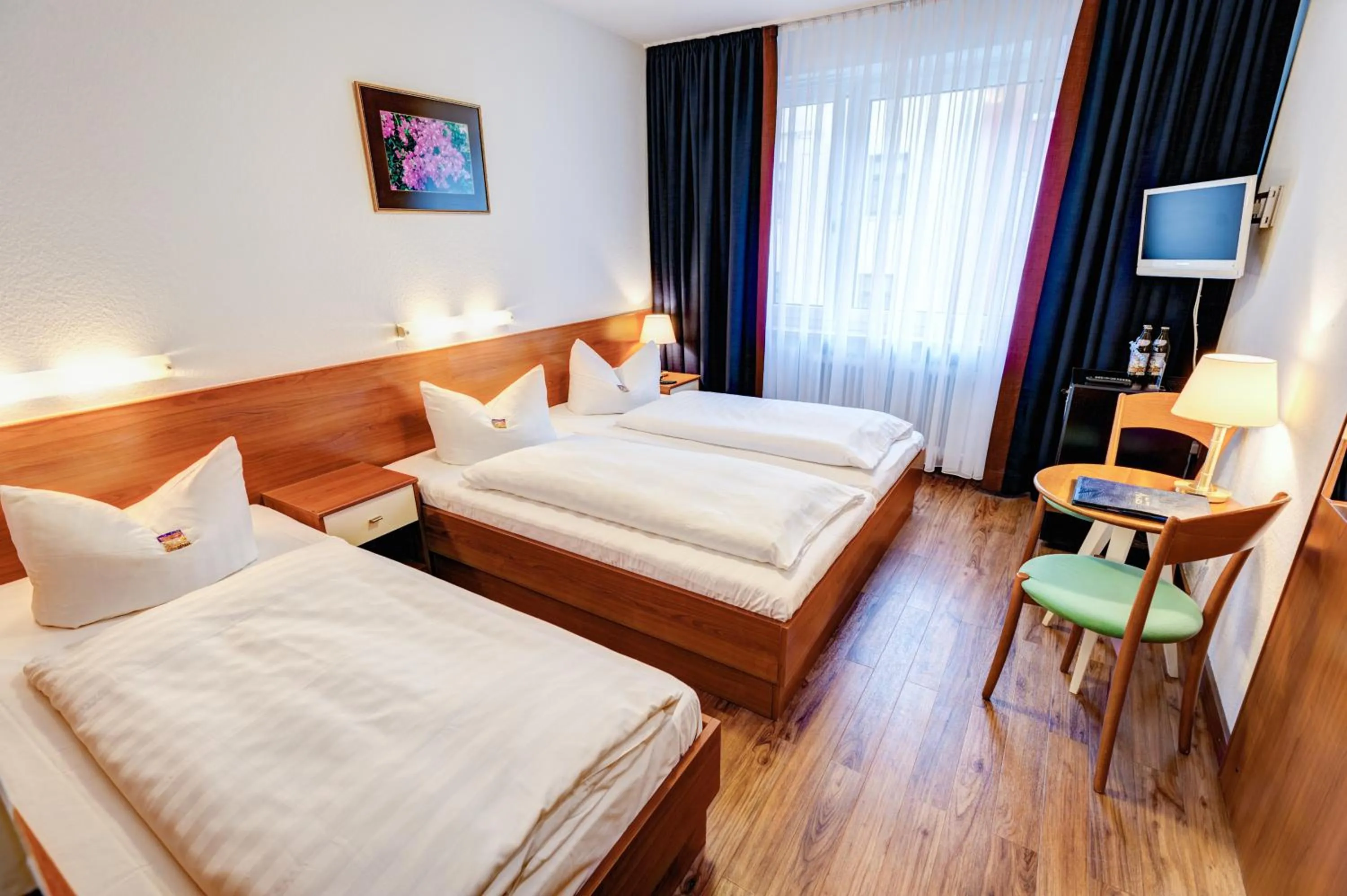 Bed in Hotel Antares München