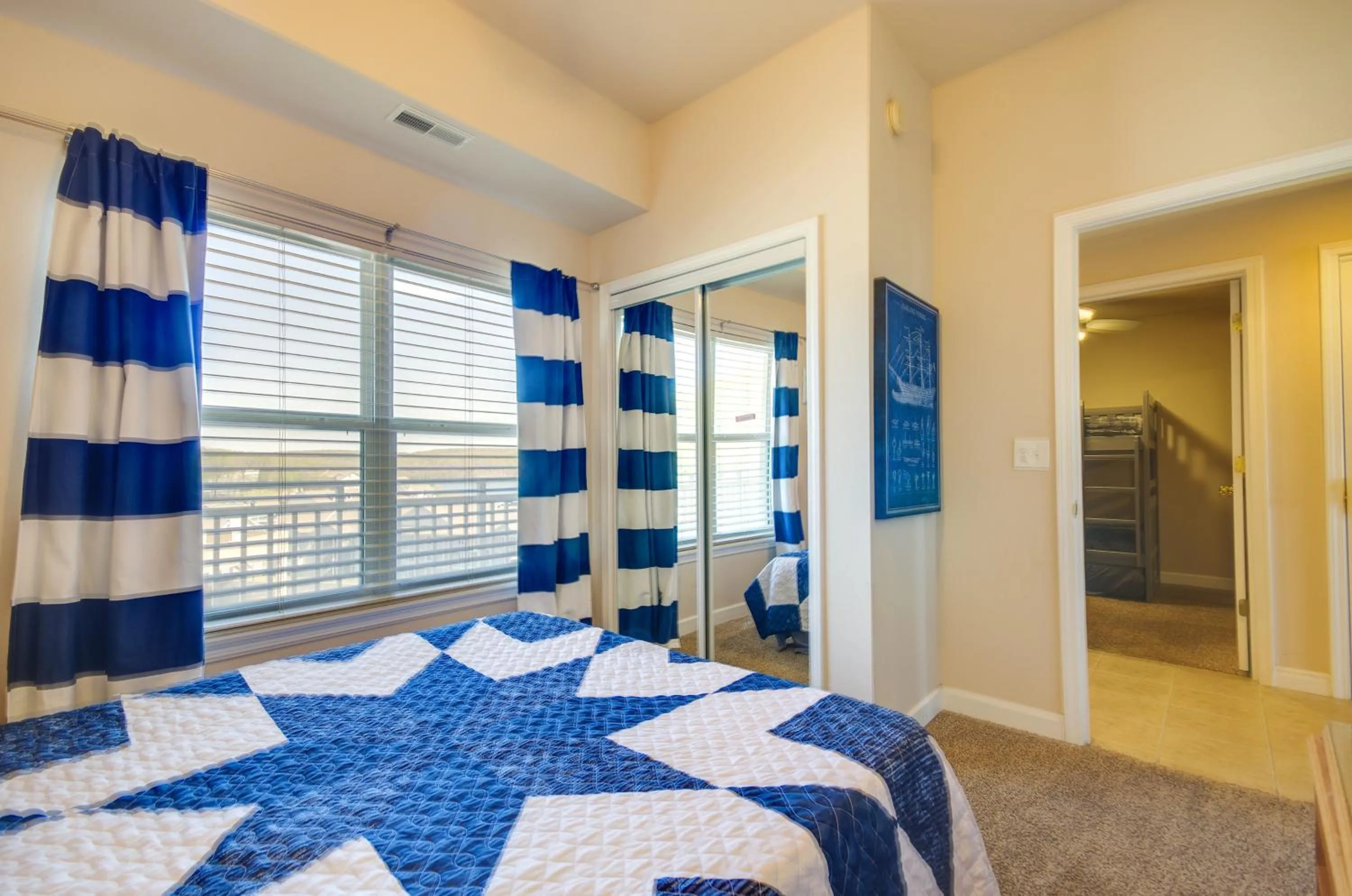 Bed in Lakefront Osage Beach Condo Balcony and Pool Access