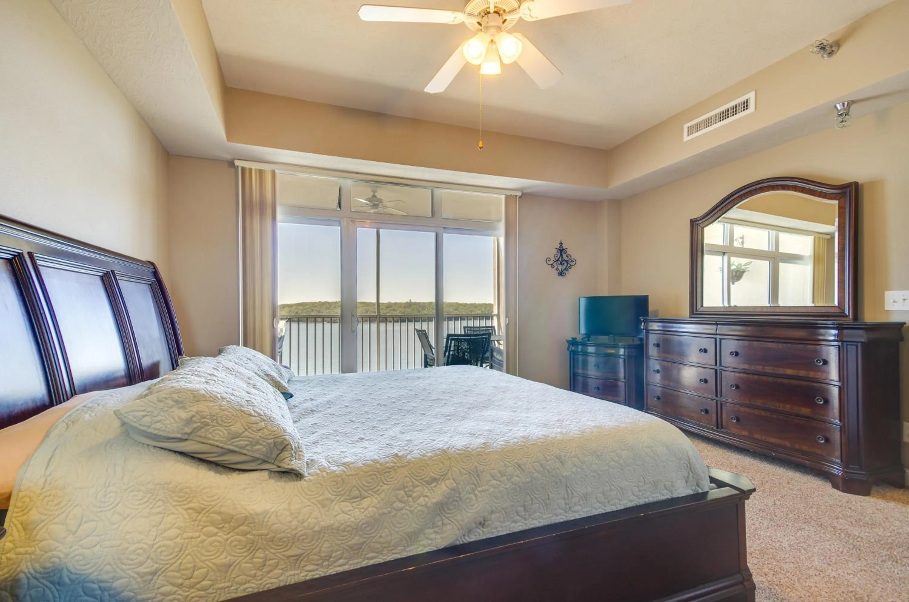 Bed in Lakefront Osage Beach Condo Balcony and Pool Access