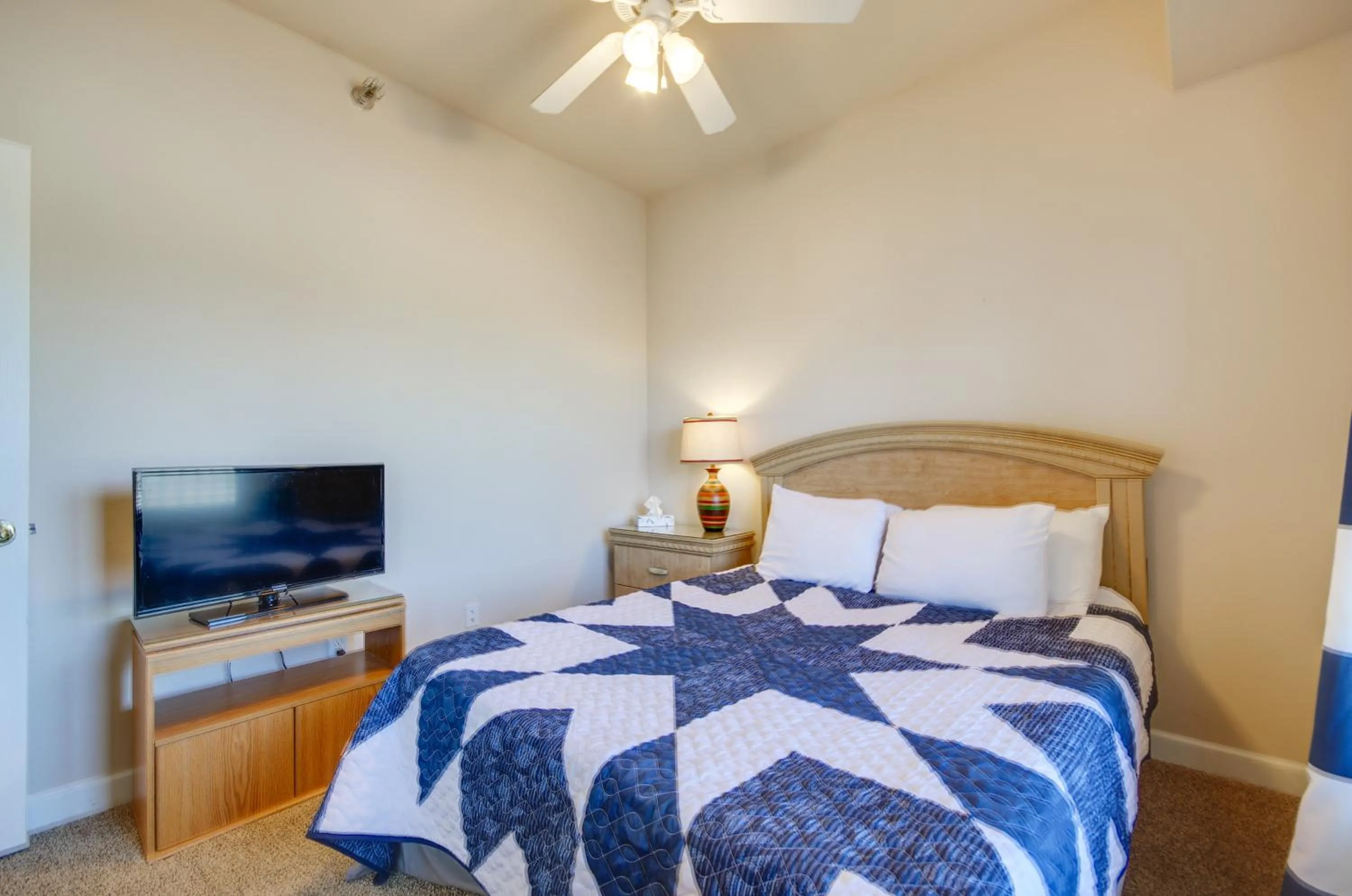 Bed in Lakefront Osage Beach Condo Balcony and Pool Access