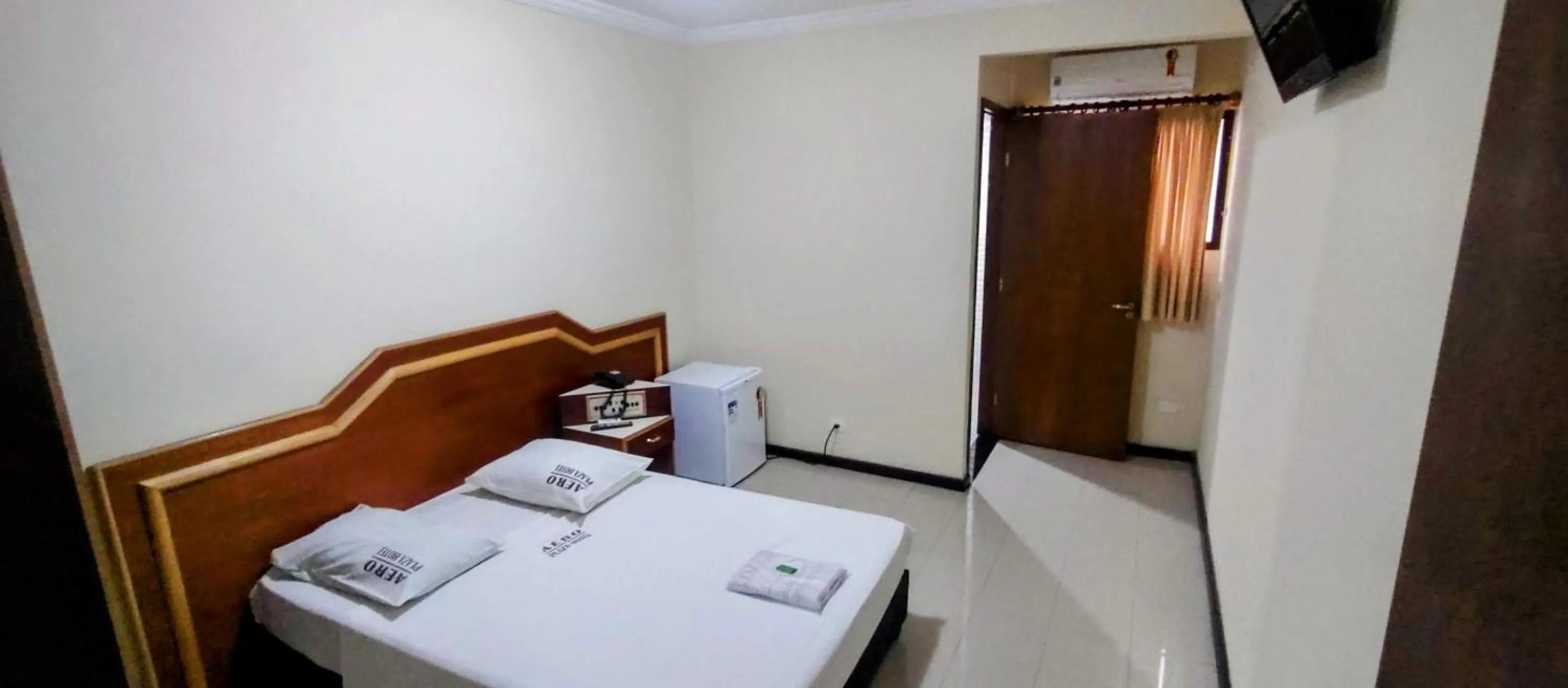 Bed in Aero Plaza Hotel