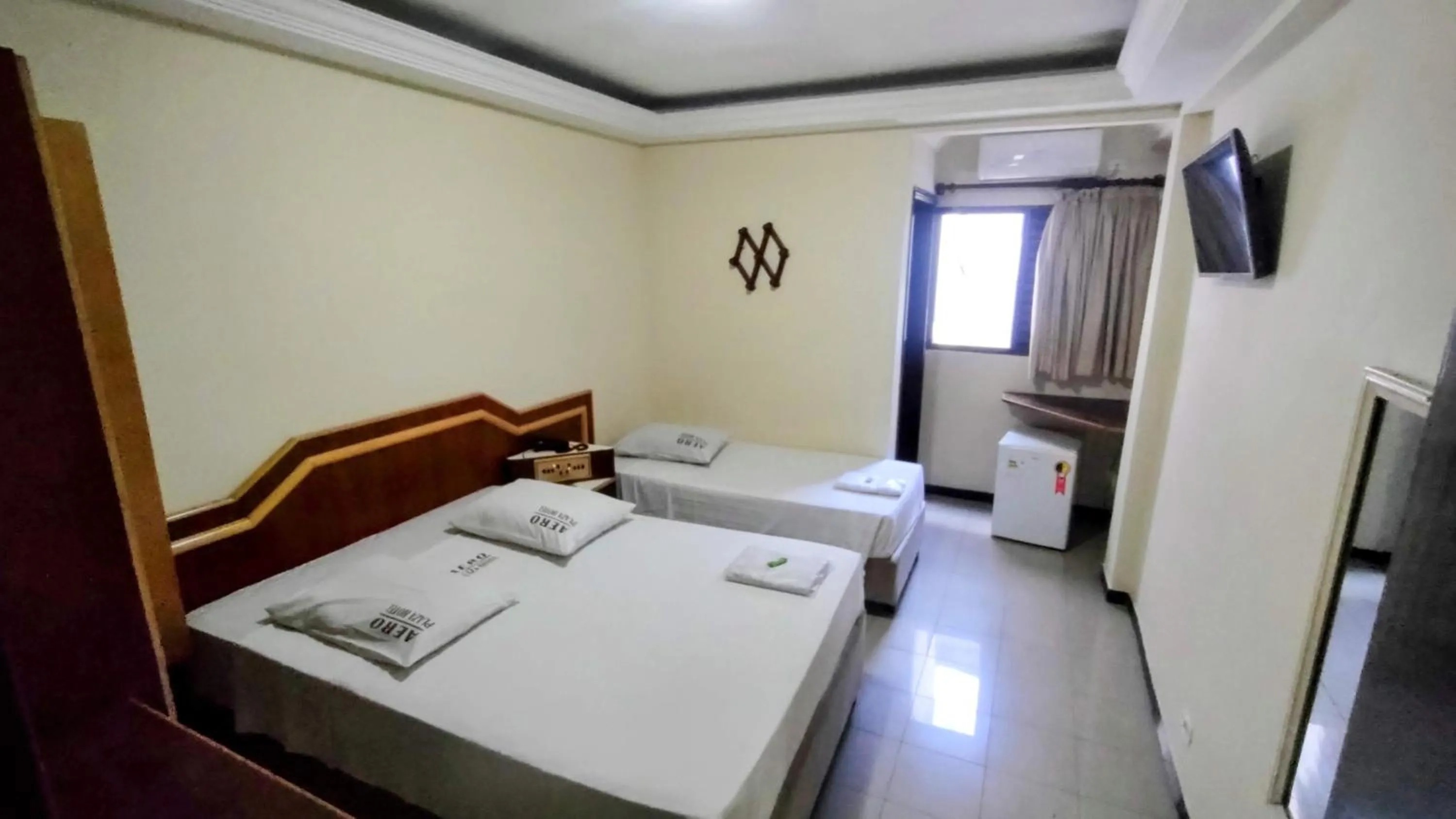 Bed in Aero Plaza Hotel