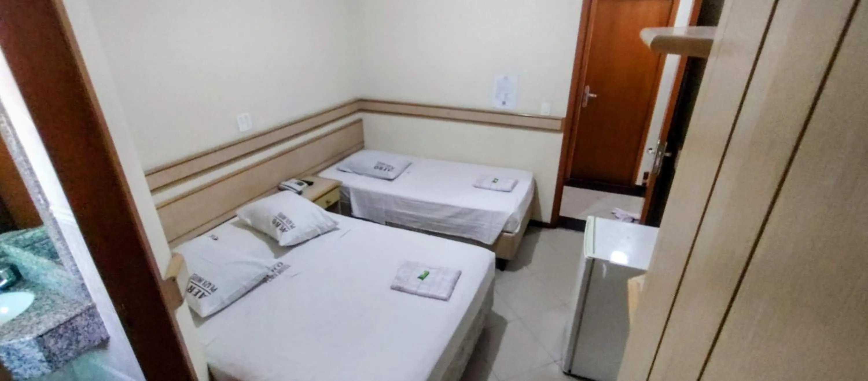 Bed in Aero Plaza Hotel