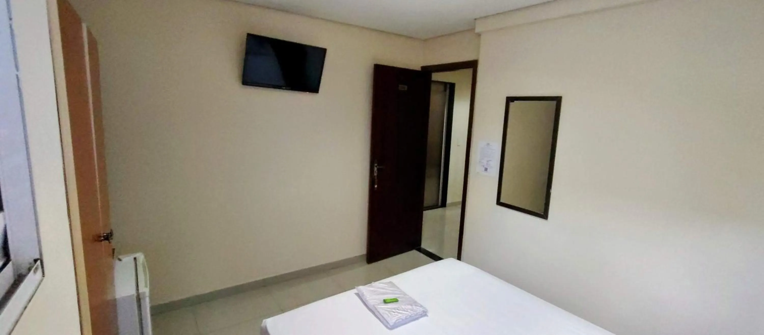 Bed in Aero Plaza Hotel