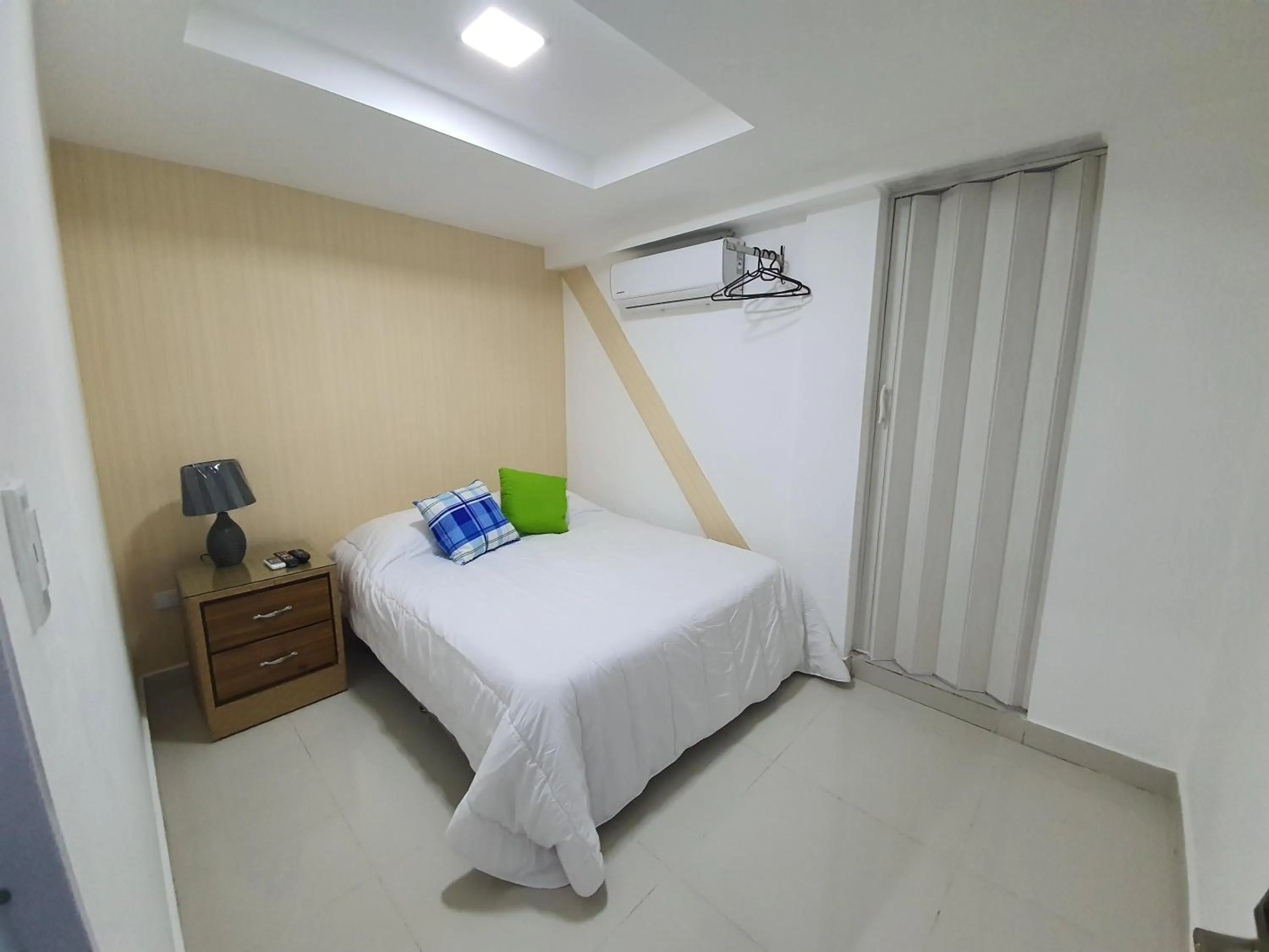 Bed in Malecon Premium Rooms & Hotel