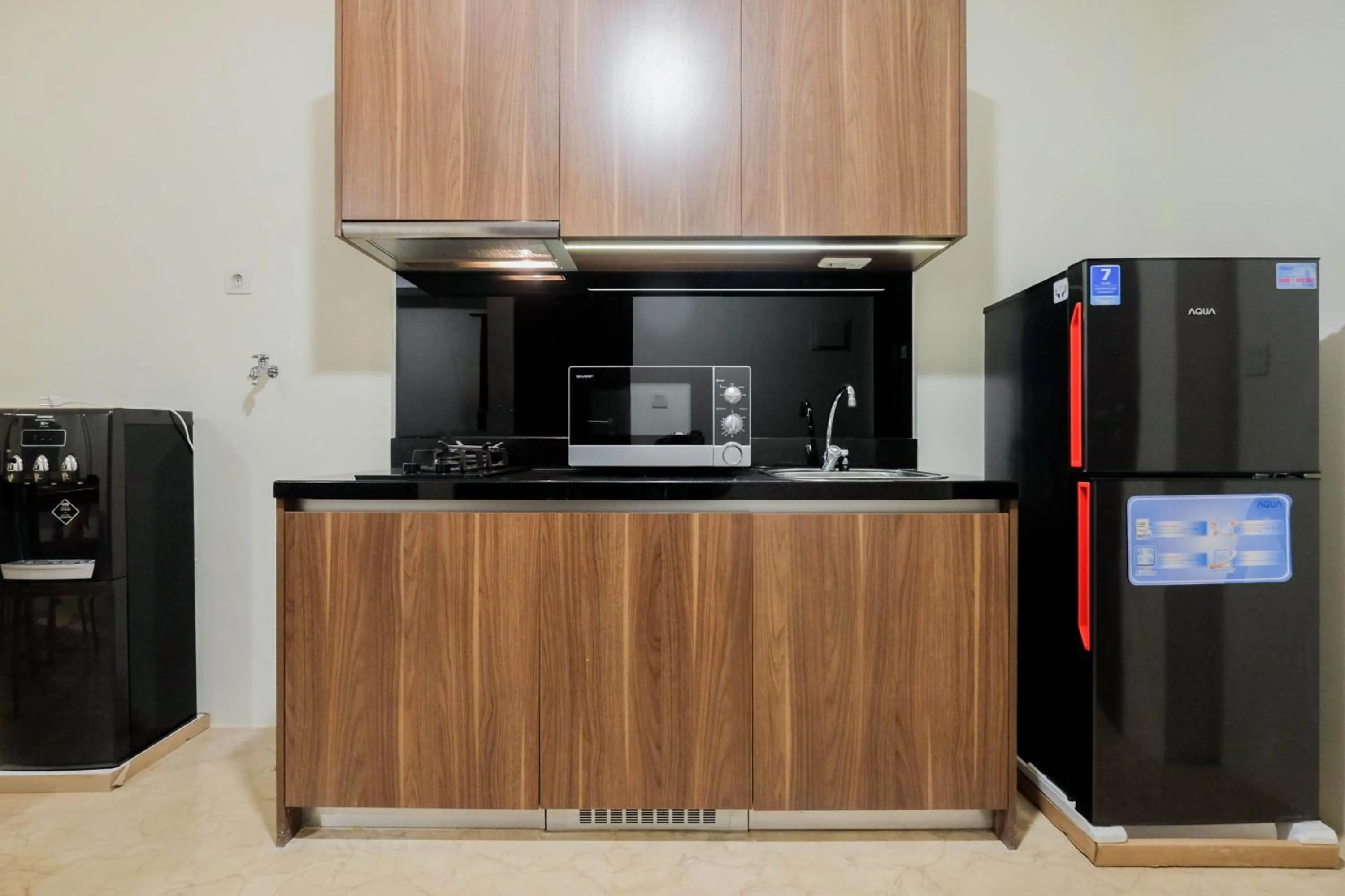 Kitchen or kitchenette in 1BR Pancoran L'Avenue Comfy Apartment By Travelio