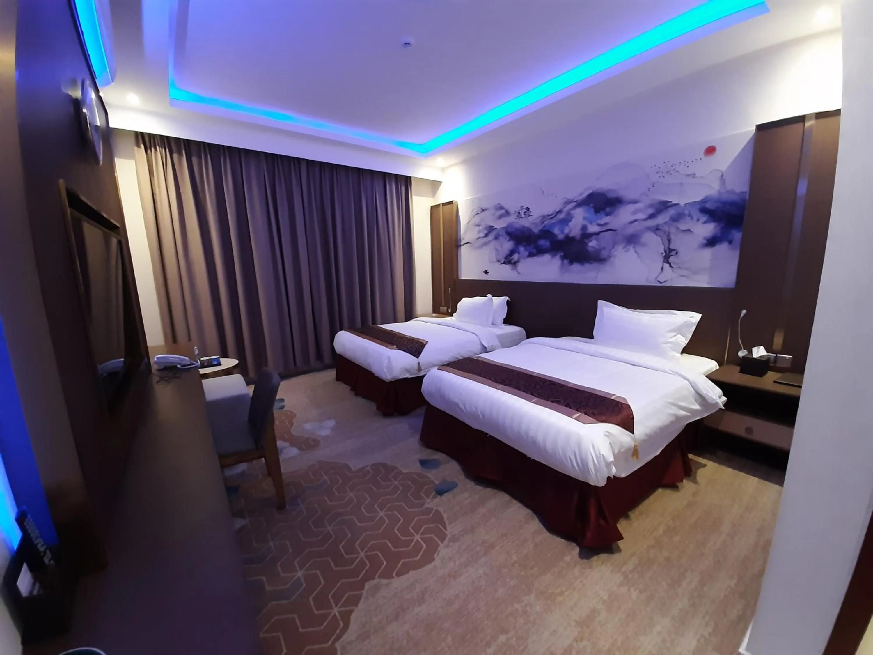 Bed in Qasr Alshamal Hotel