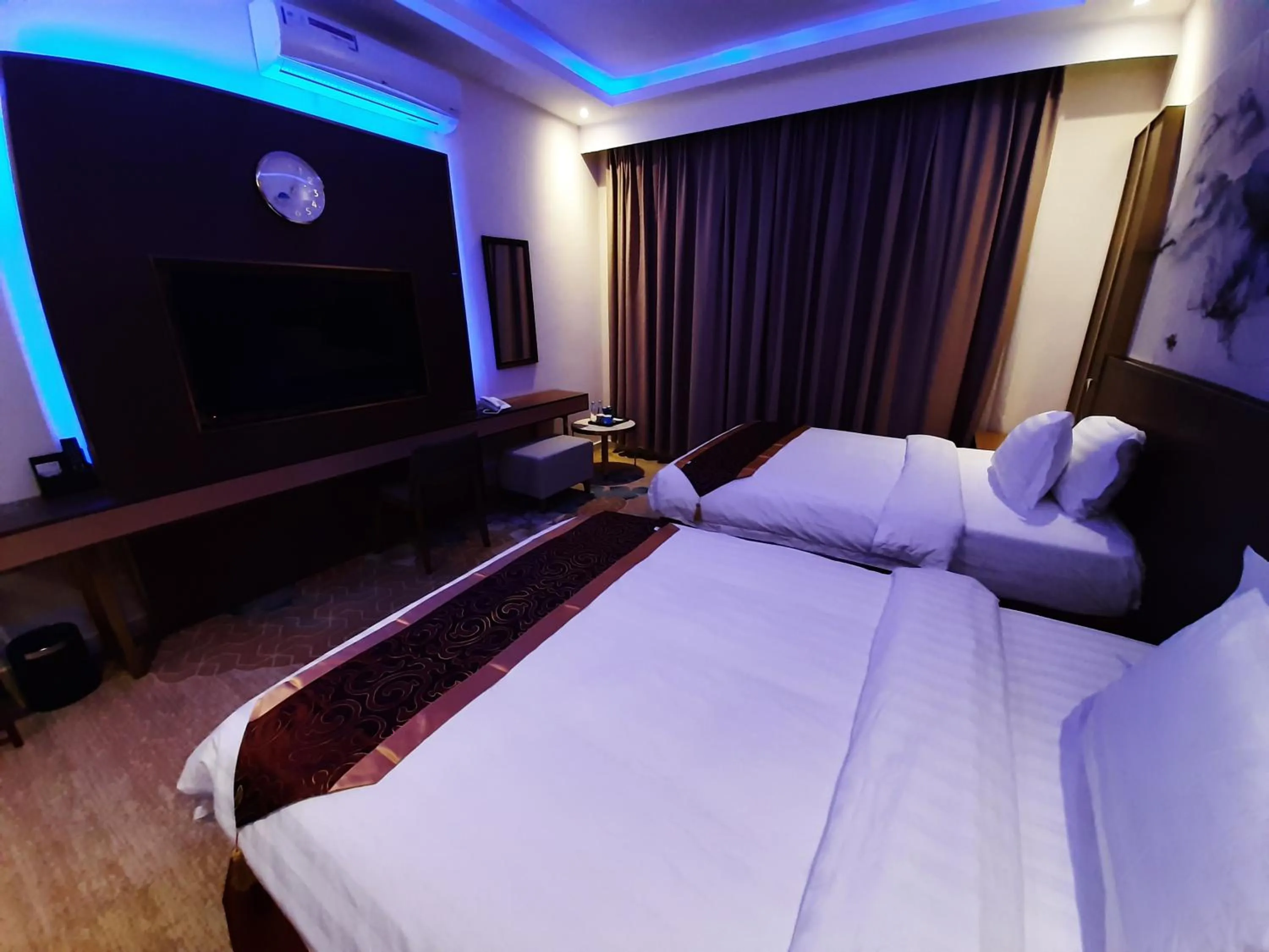 Bed in Qasr Alshamal Hotel