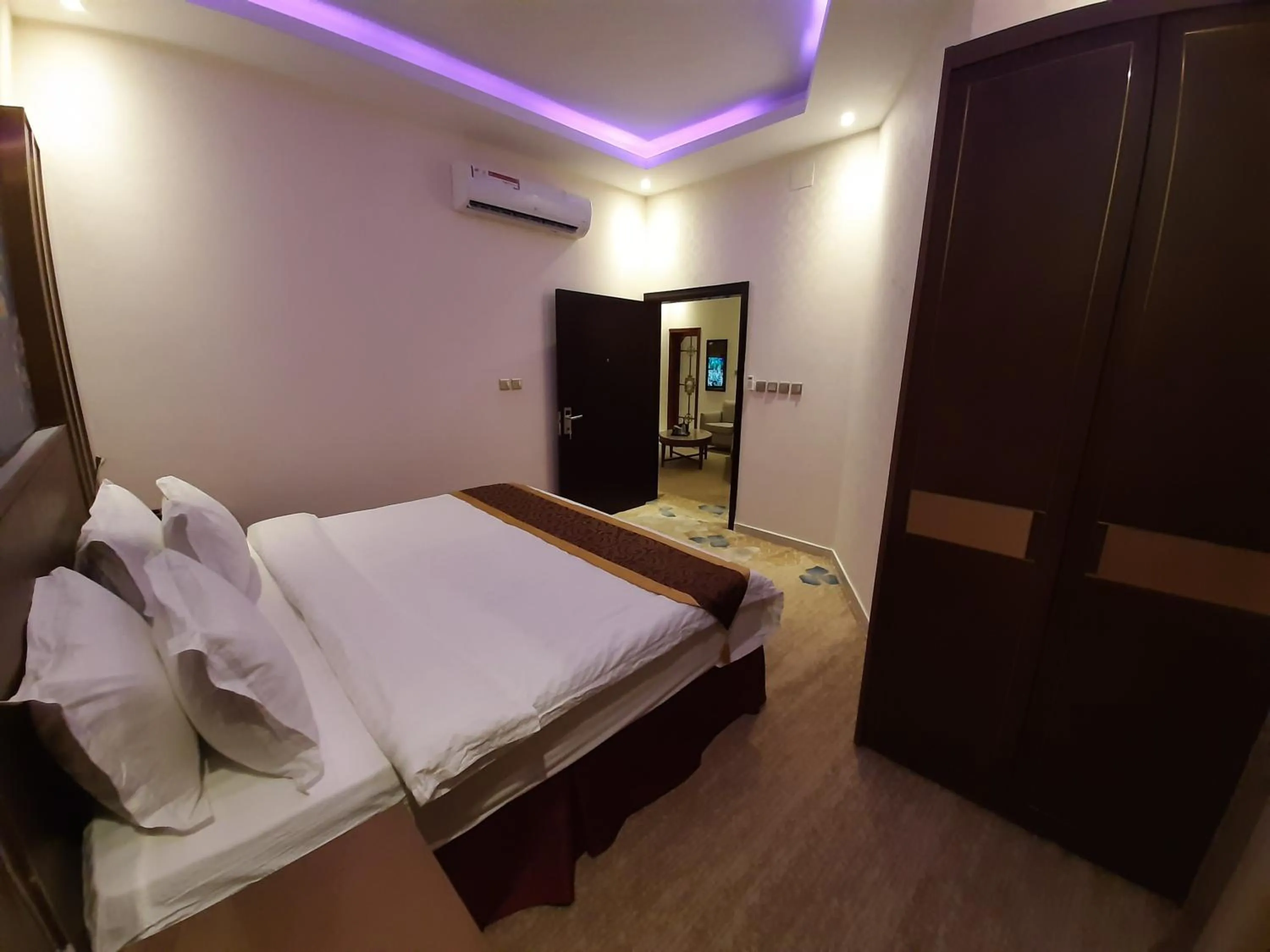 Bed in Qasr Alshamal Hotel