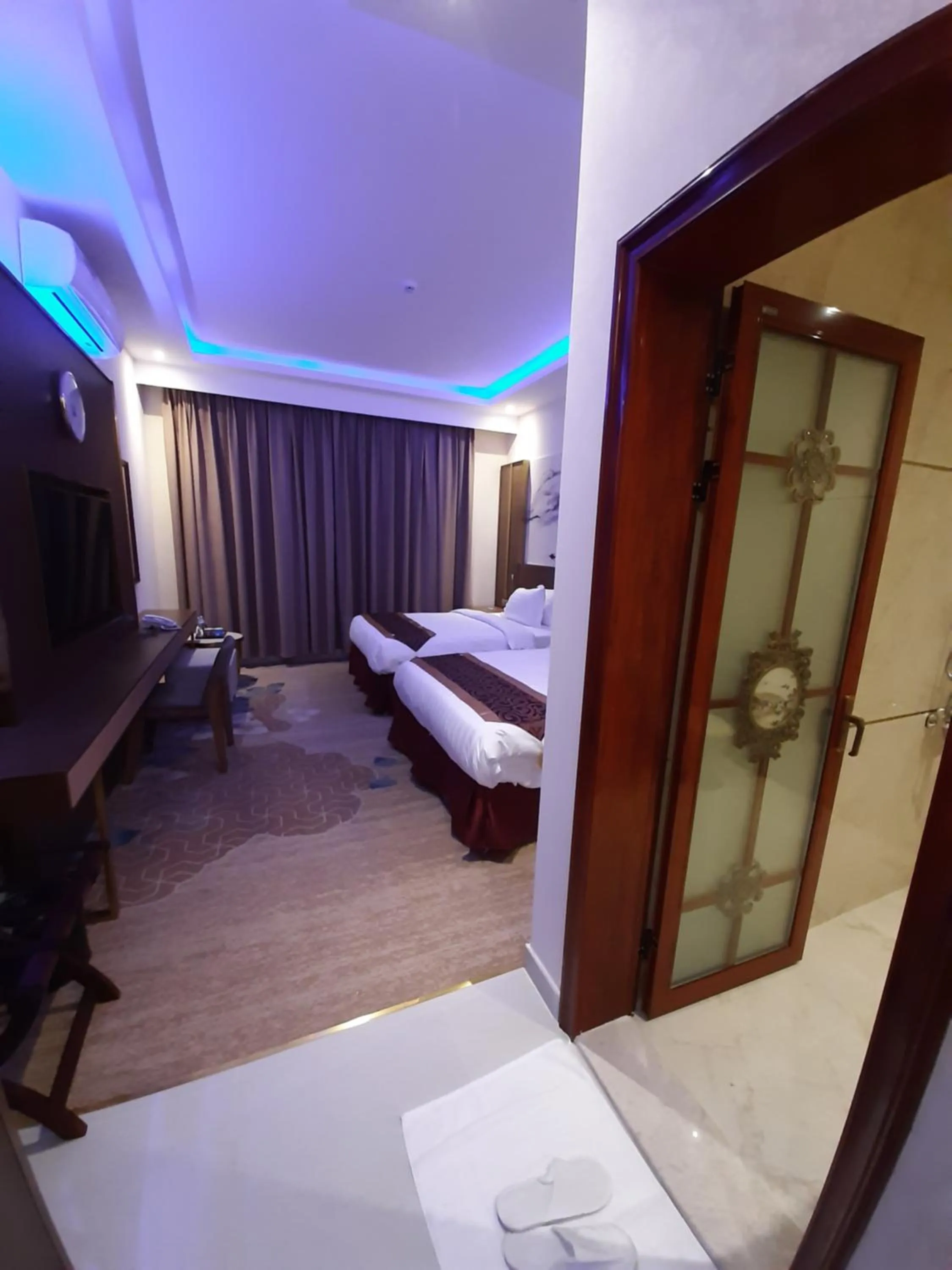 Bed in Qasr Alshamal Hotel
